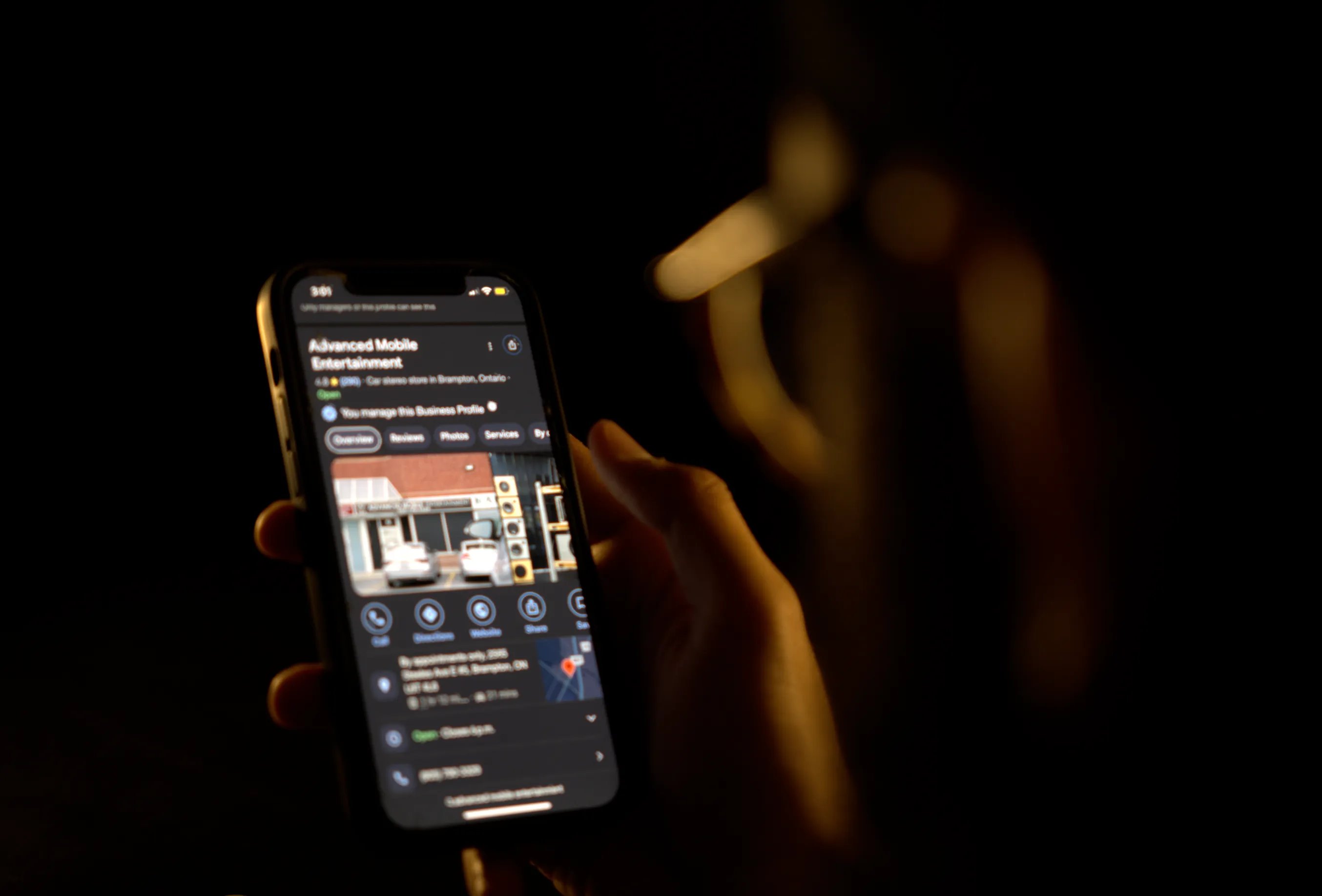 Man reviewing a google business profile on his phone
