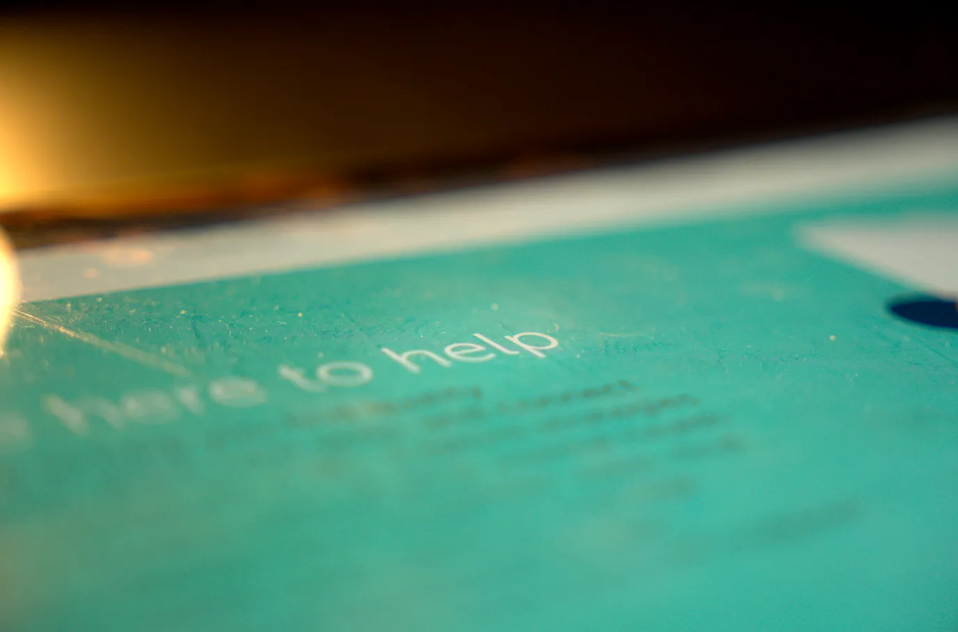 The word "help" highlighted on a tablet.