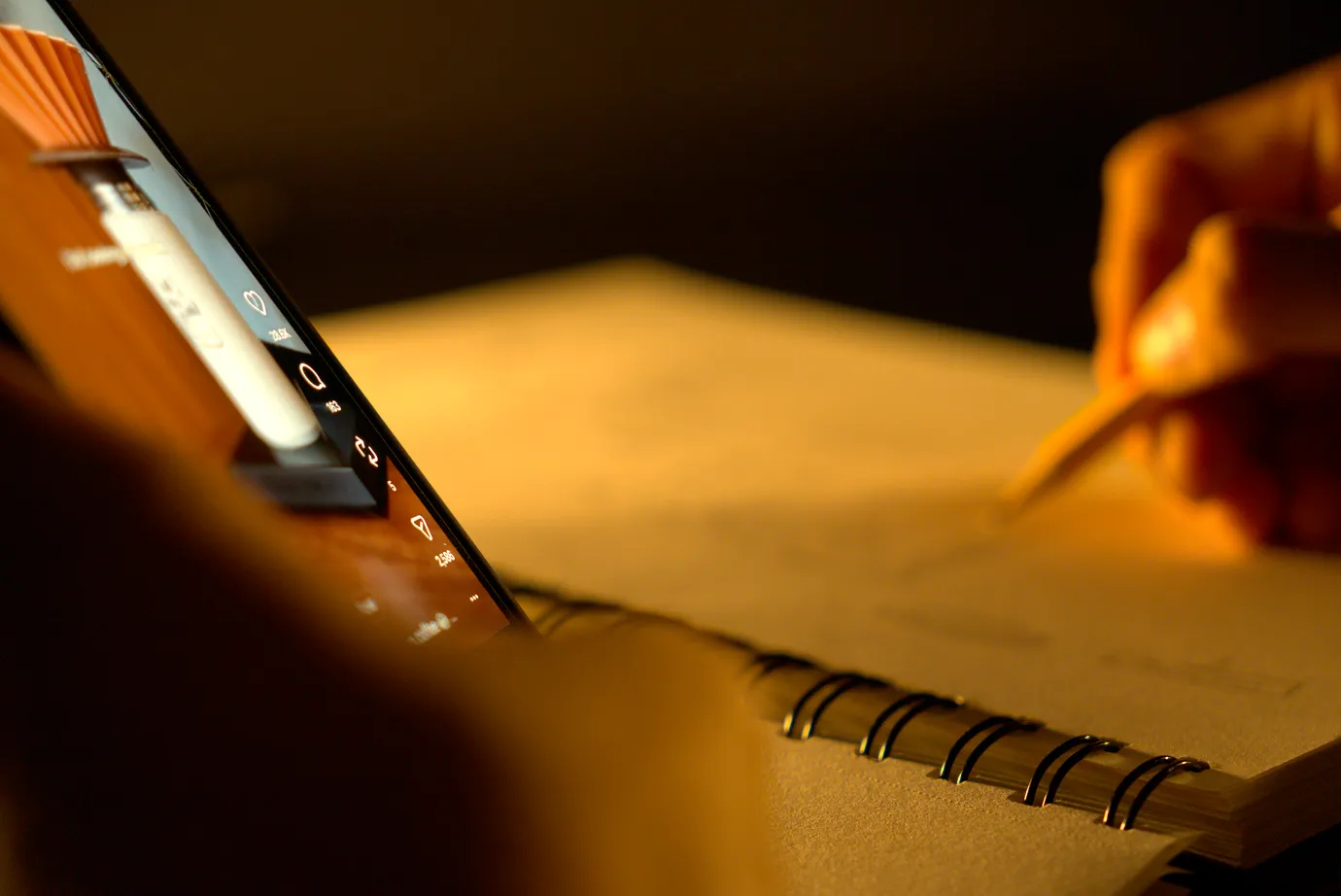 Man watching an instagram reel while taking notes. 