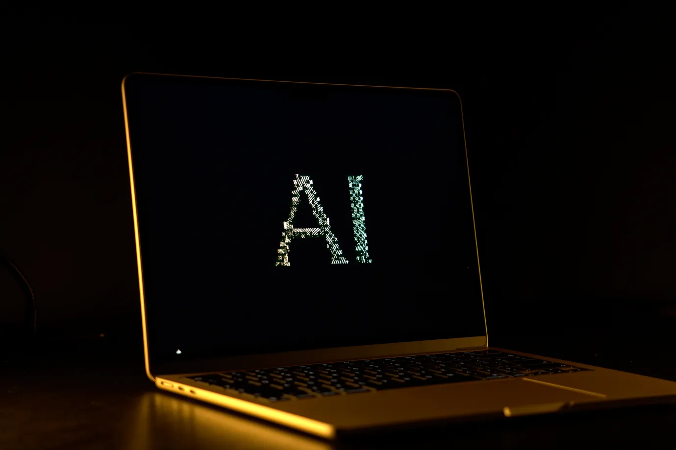 The words "AI" displayed on a laptop.