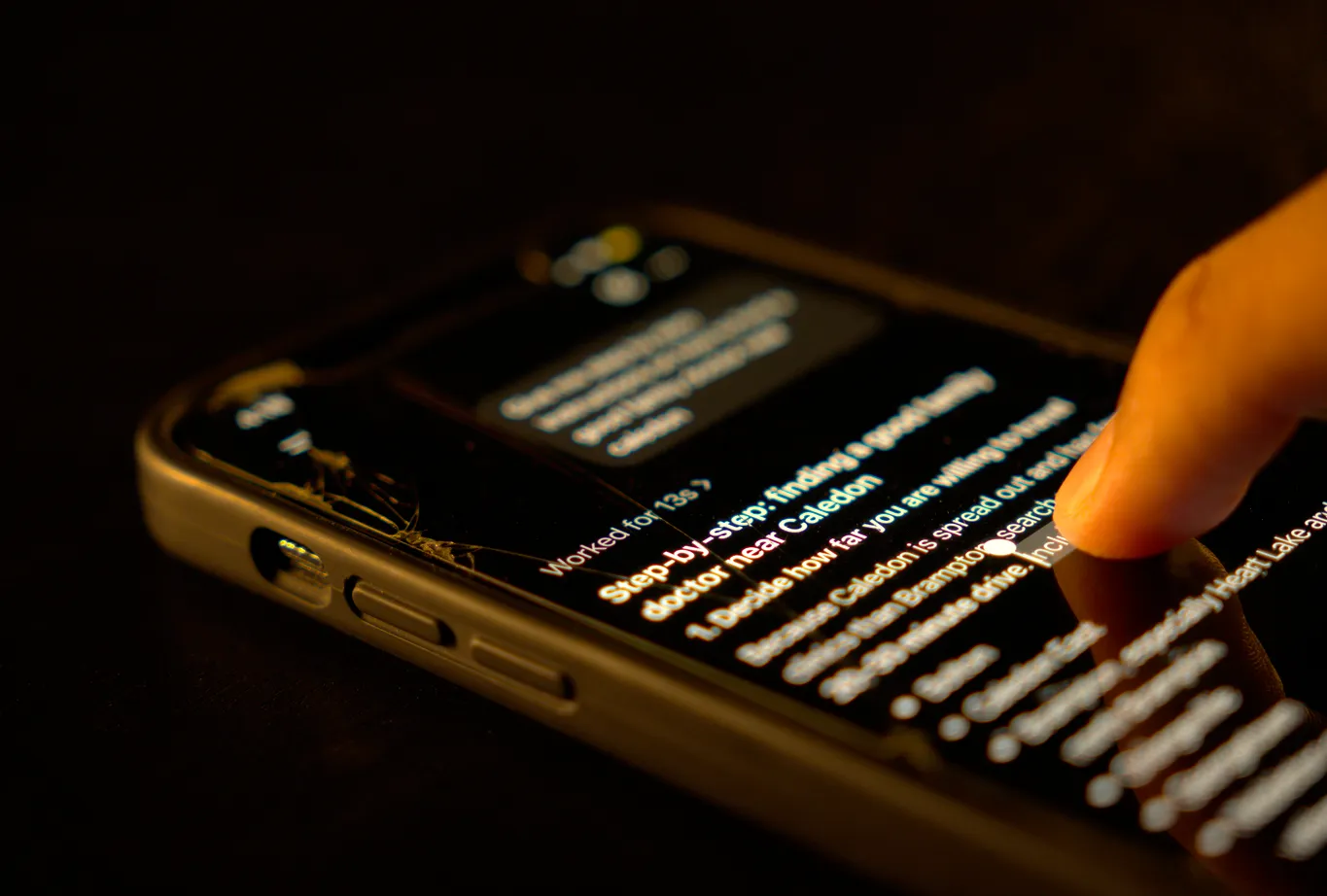 Man reading AI response following prompt on his phone.