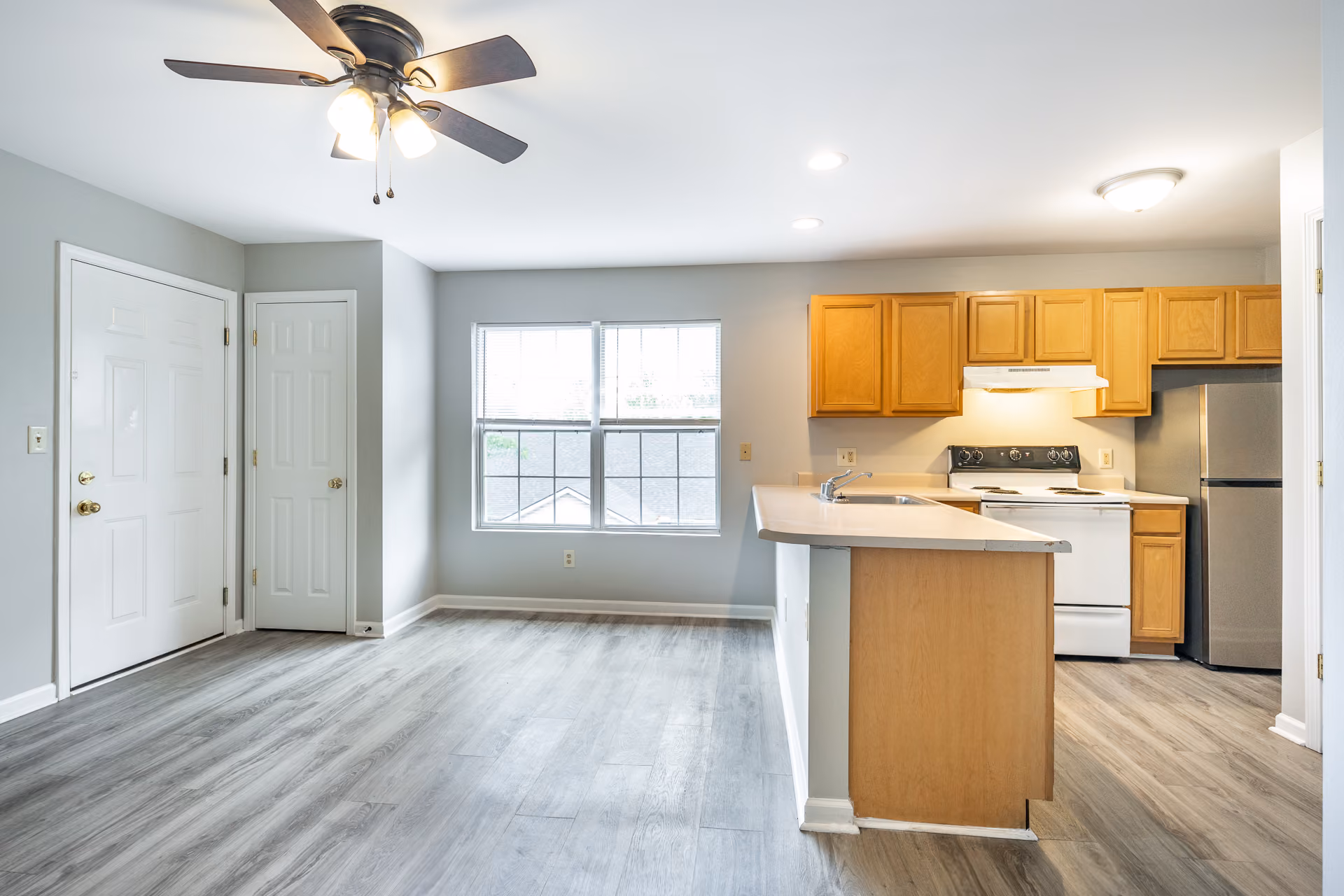 Wide view of kitchen and dining area