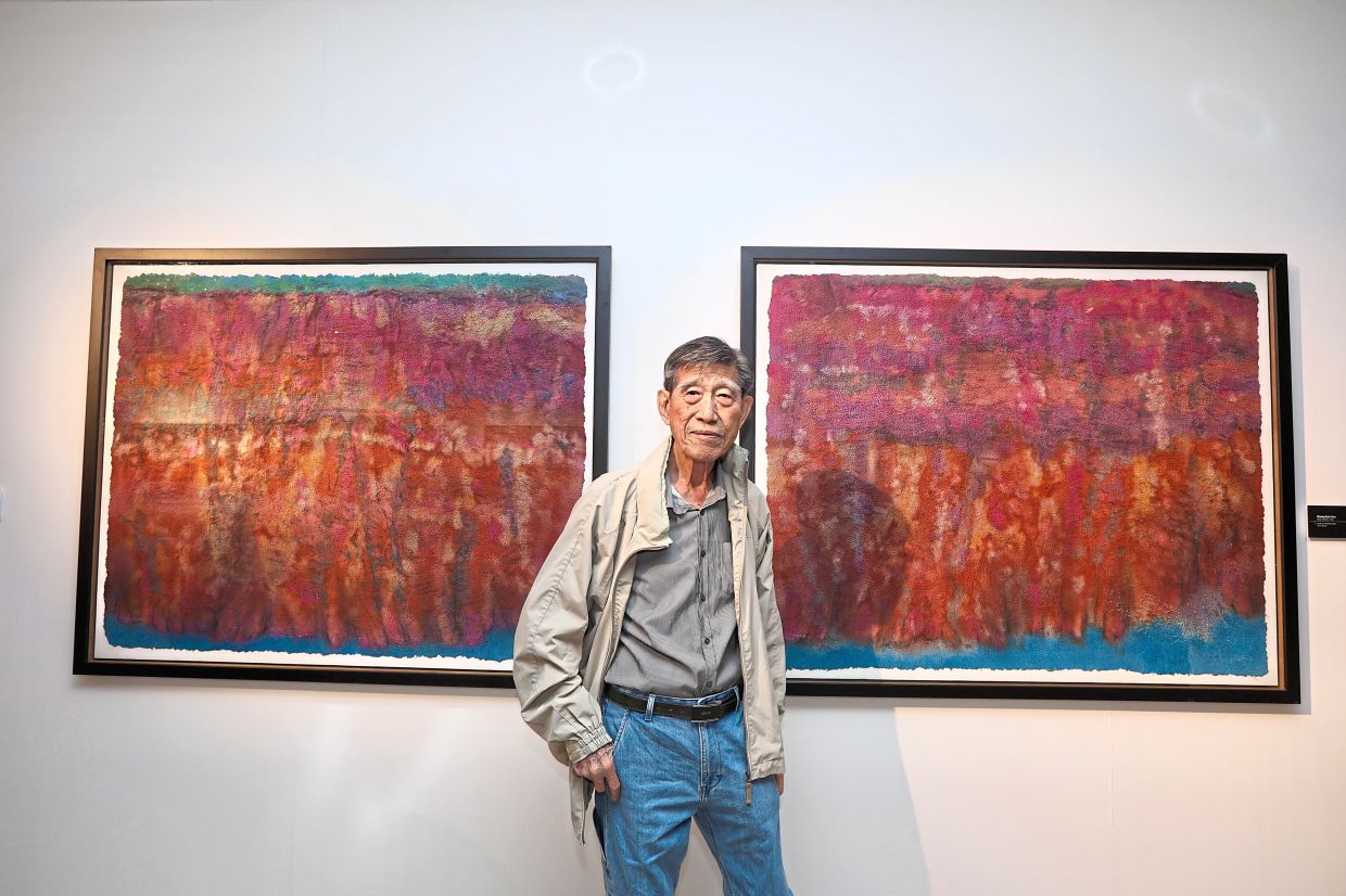 Senior artist and academic Choong poses with his 'Colour Orchestra' series (1992), painted on handmade paper and accompanied by symphonic music. Photo: The Star/Low Lay Phon