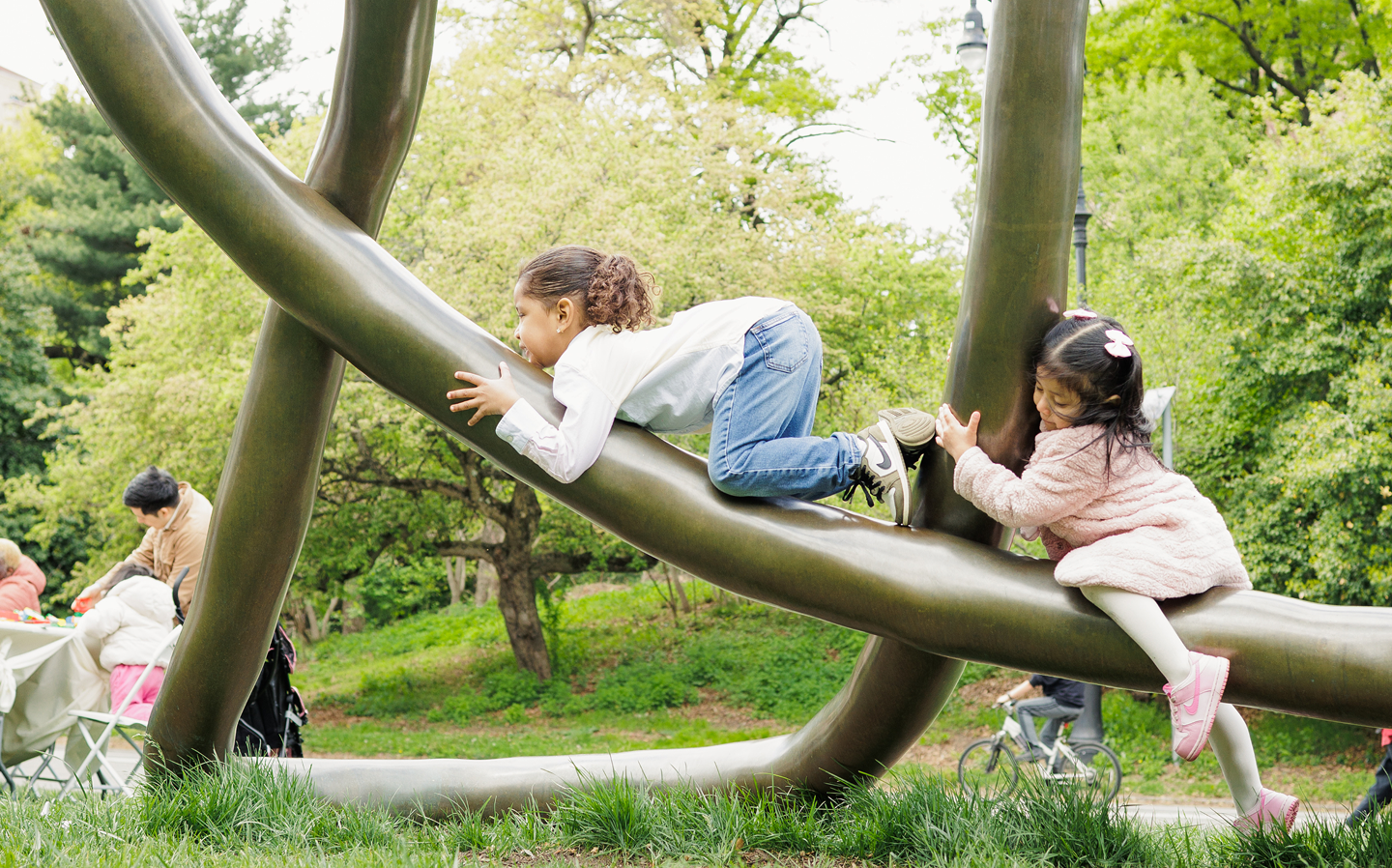Children playing on the Monuments to Motherhood sculpture