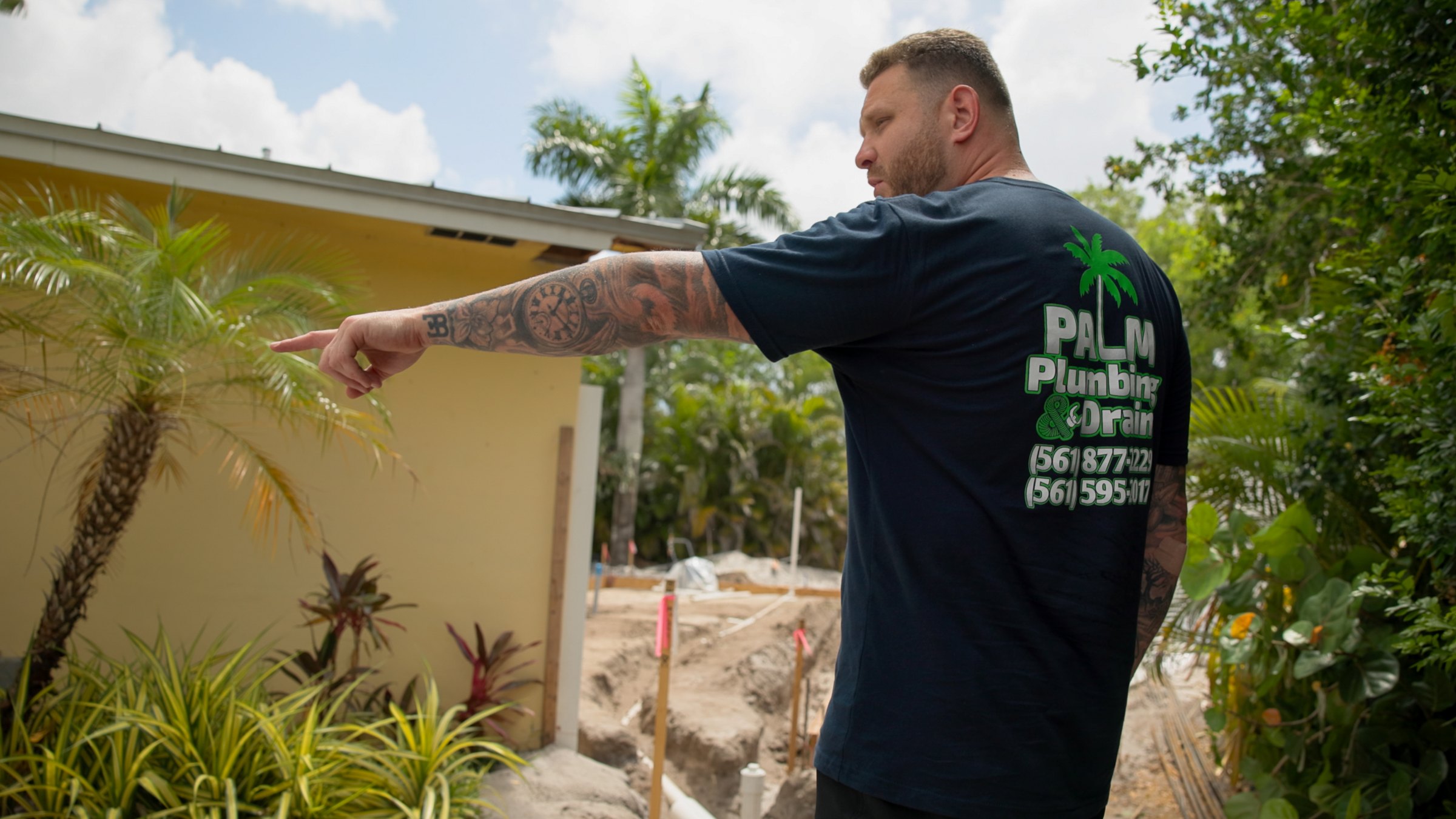 Palm technician walking through a residential job site