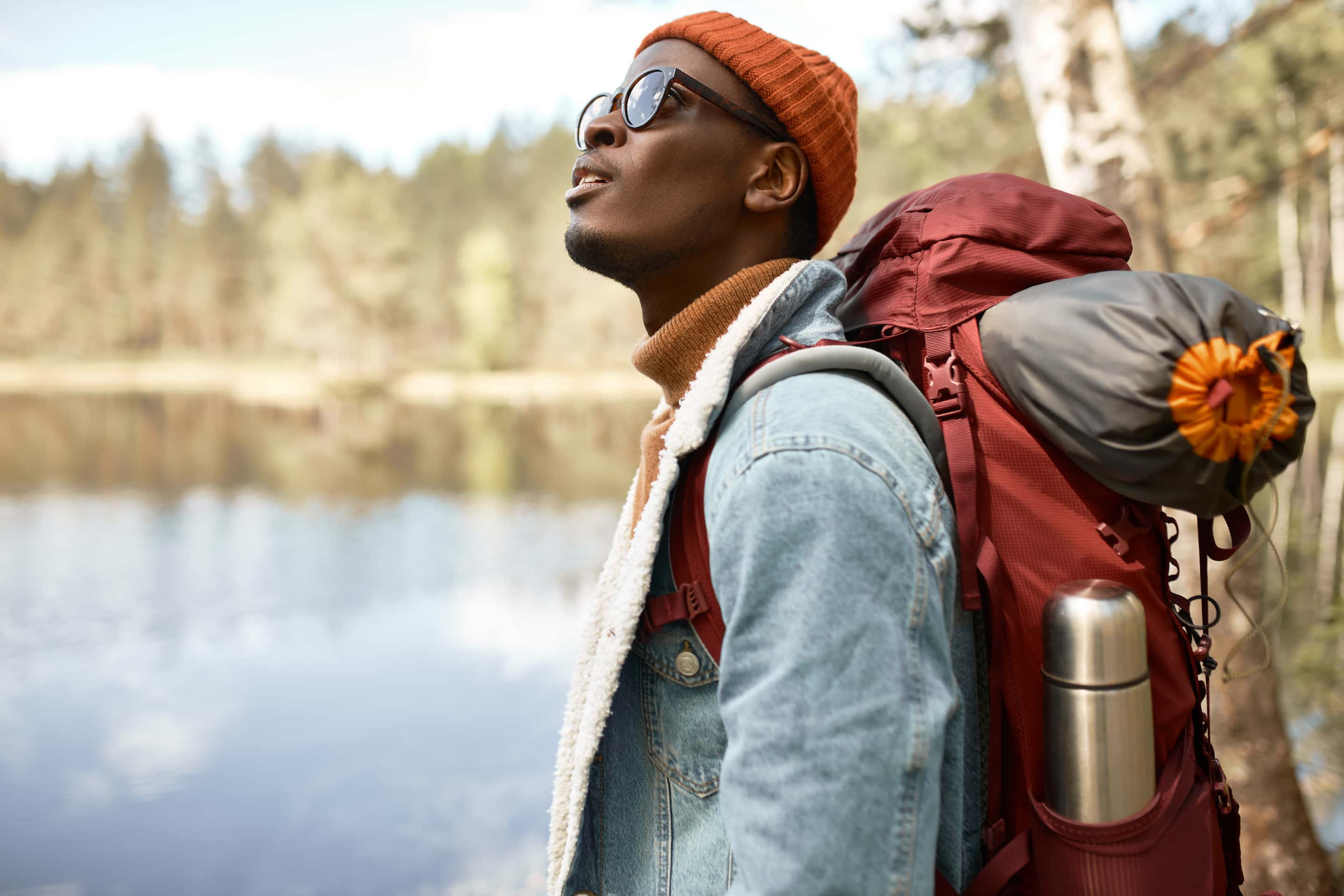 Man walking in woods admiring the wonder of nature
