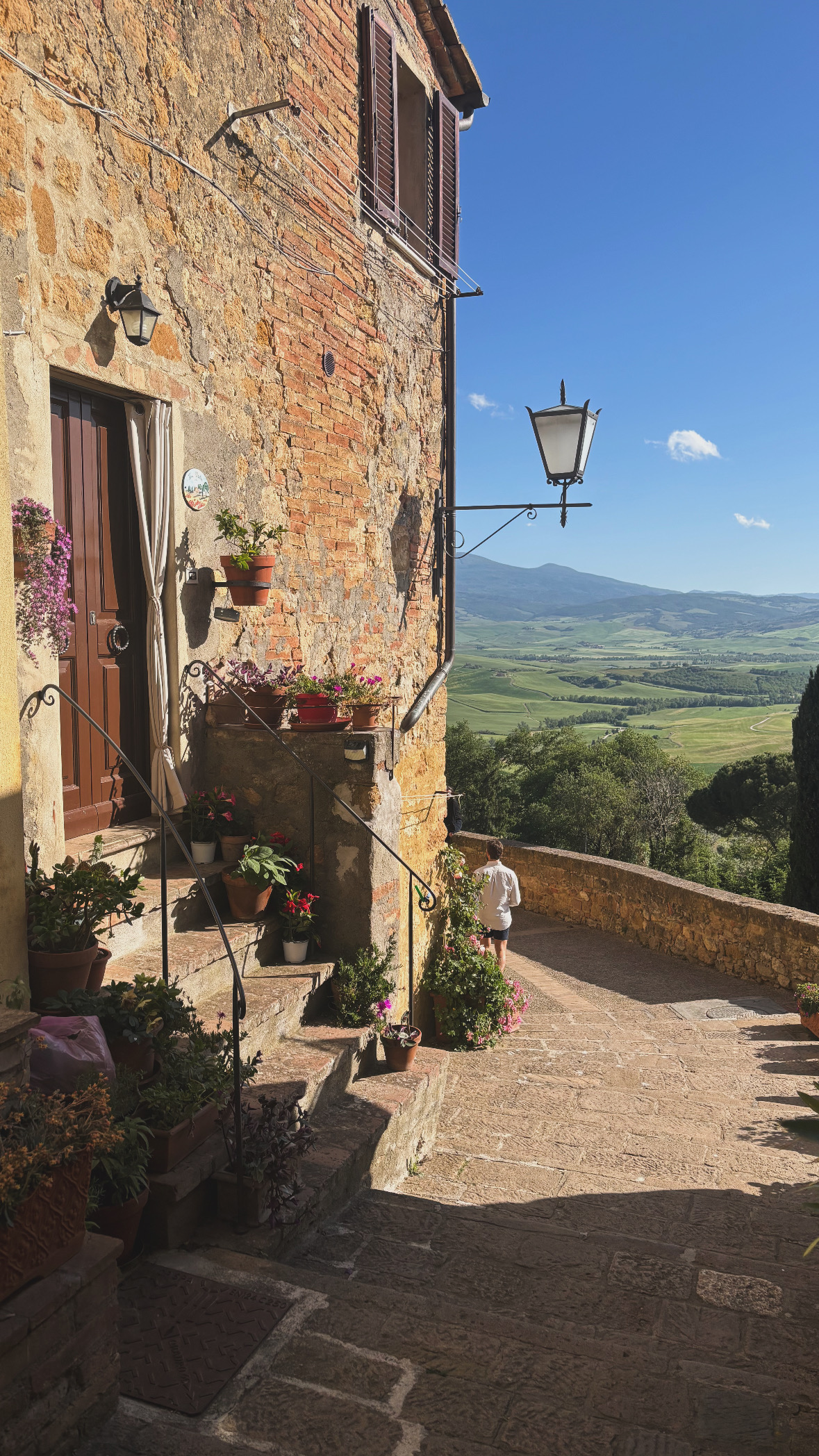 Scenic street in Pienza overlooking the Tuscan countryside