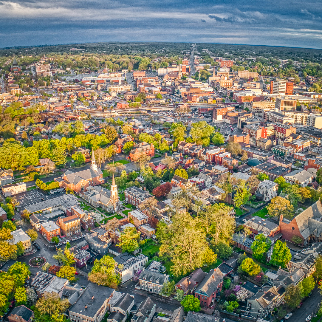 Aerial view of downtown Schenectady, NY, with historic church steeples and city skyline