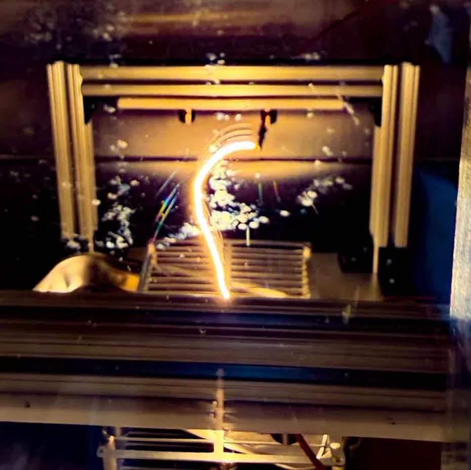 Helium being accelerated toward Moon dirt simulant for implantation