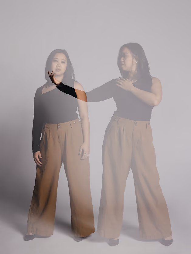 Double exposure of Christina in black top and brown pants, one facing forward and the other reaching out.