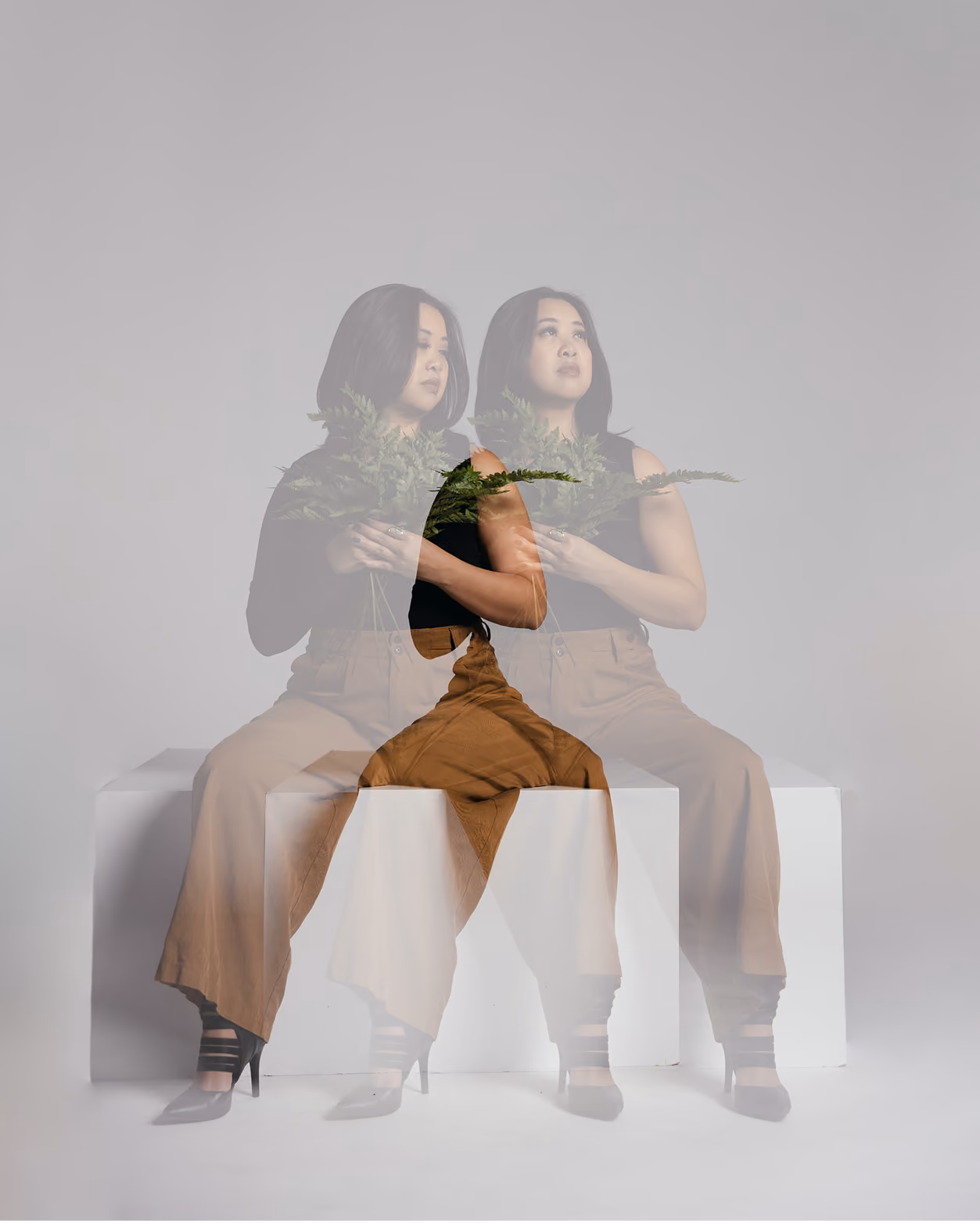 A headshot of Christina Nguyen with double exposure.