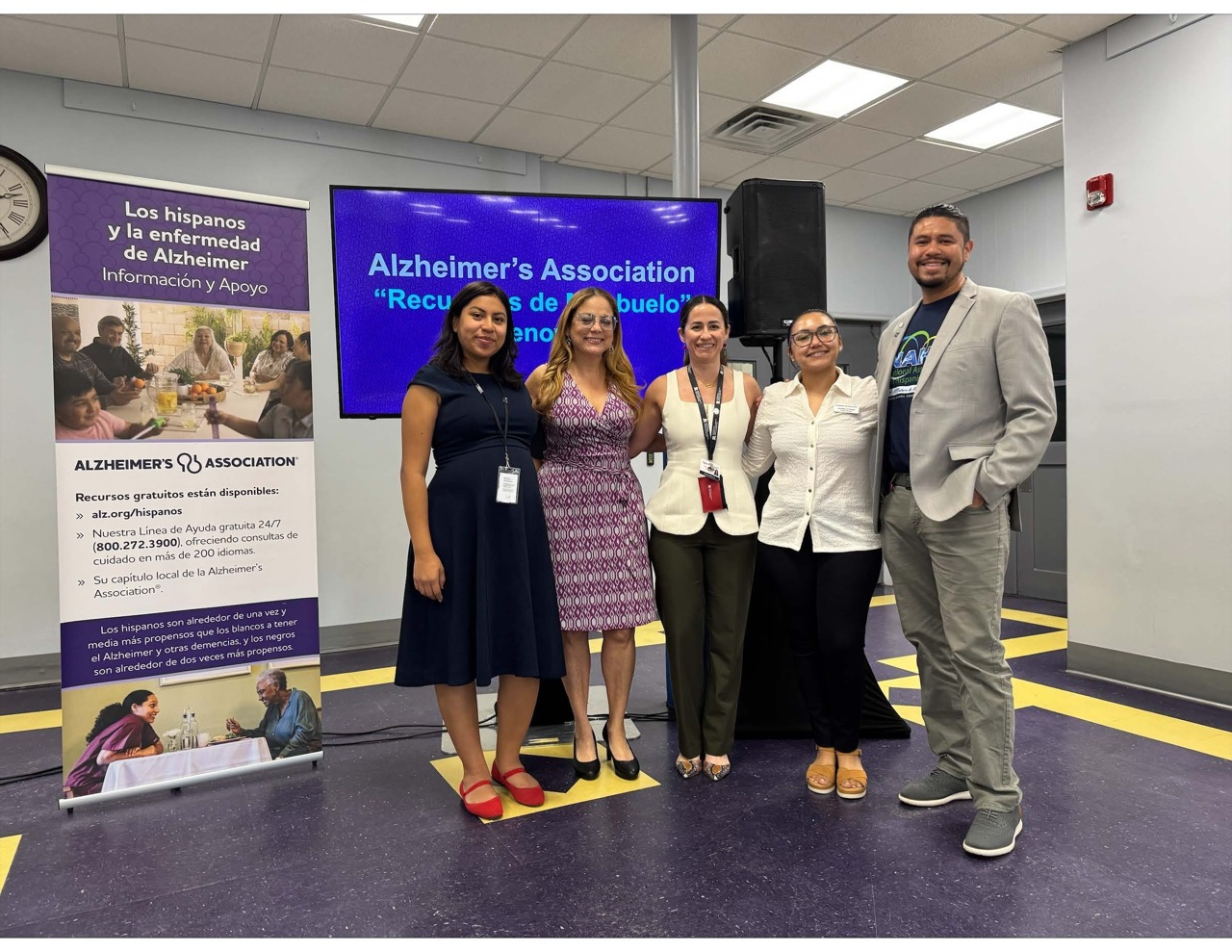 A group of presenters standing at an Alzheimer's Association community event focused on Hispanic Alzheimer's education and support