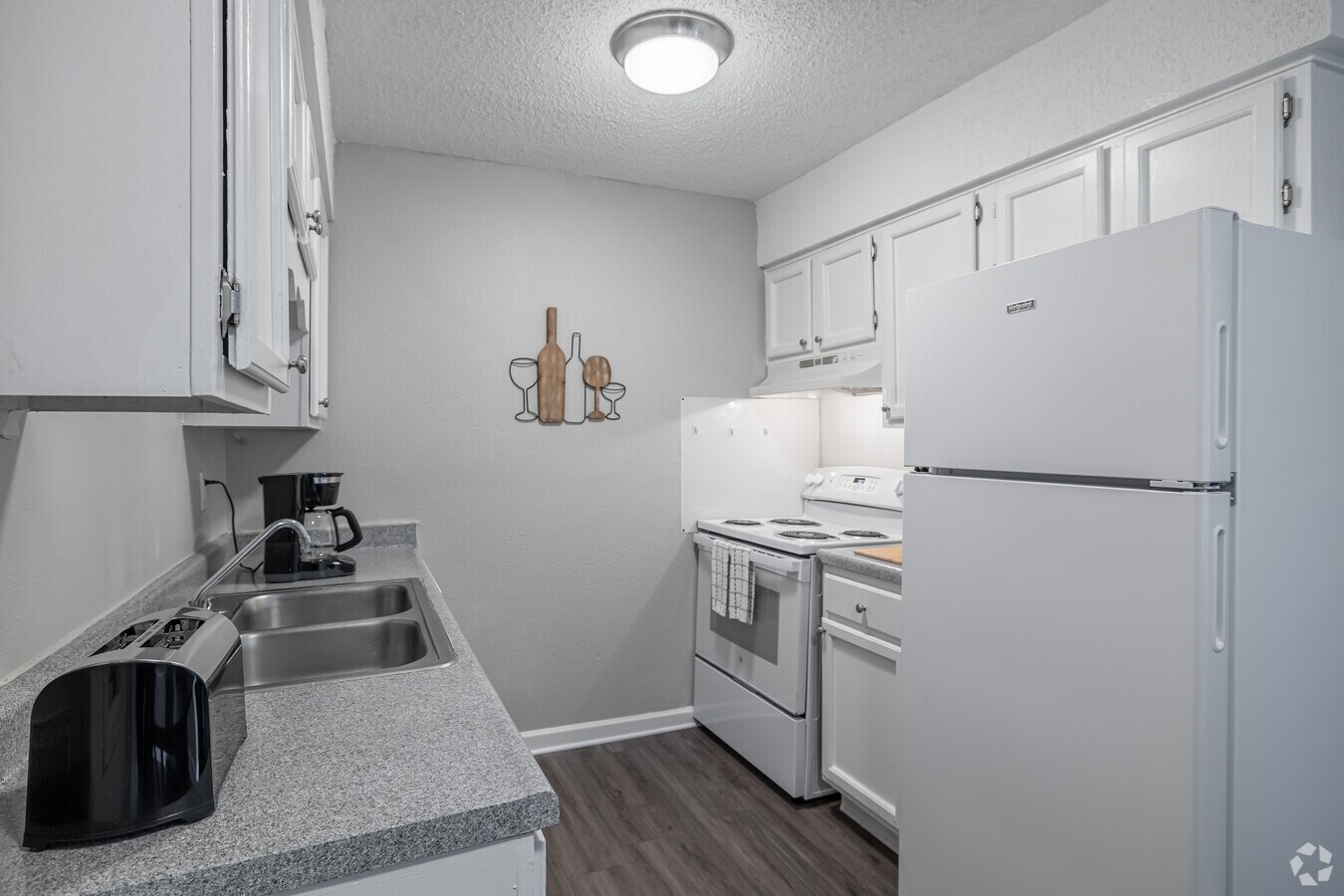 One bedroom kitchen with white cabinets at Residences at The Overlook