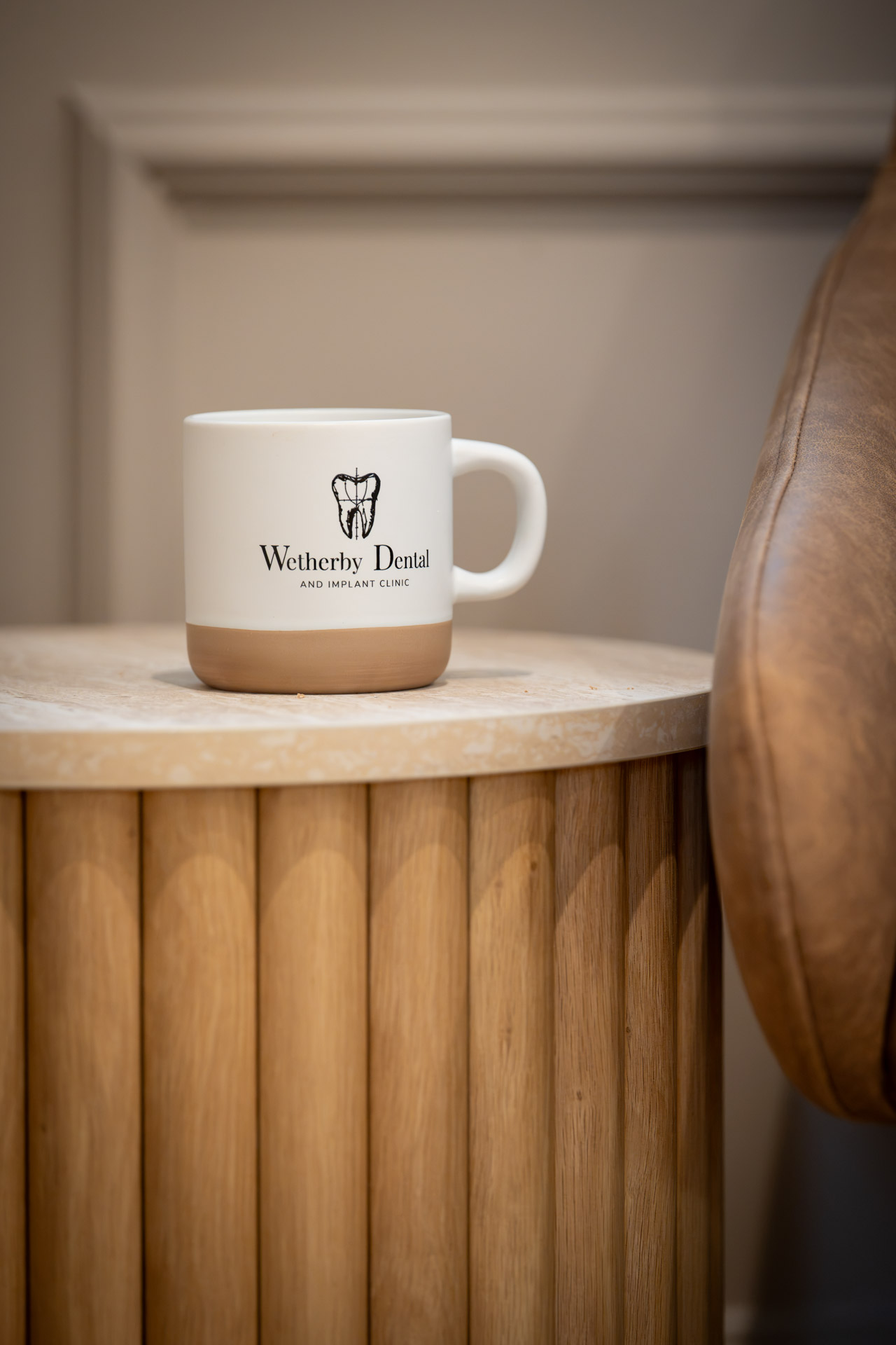 Wetherby Dental mug on a fluted wooden side table