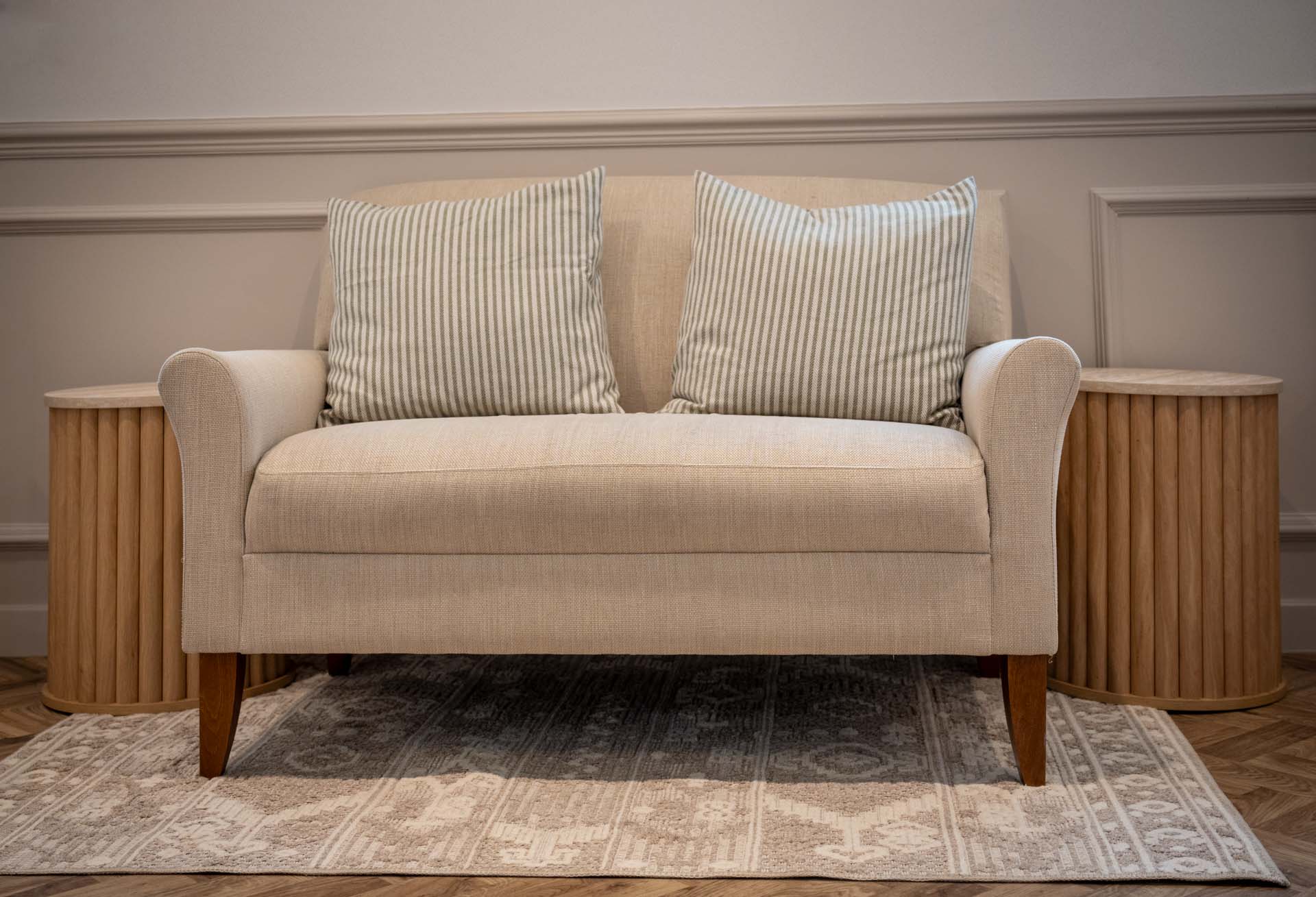 Cream sofa with cushions in the patient waiting area