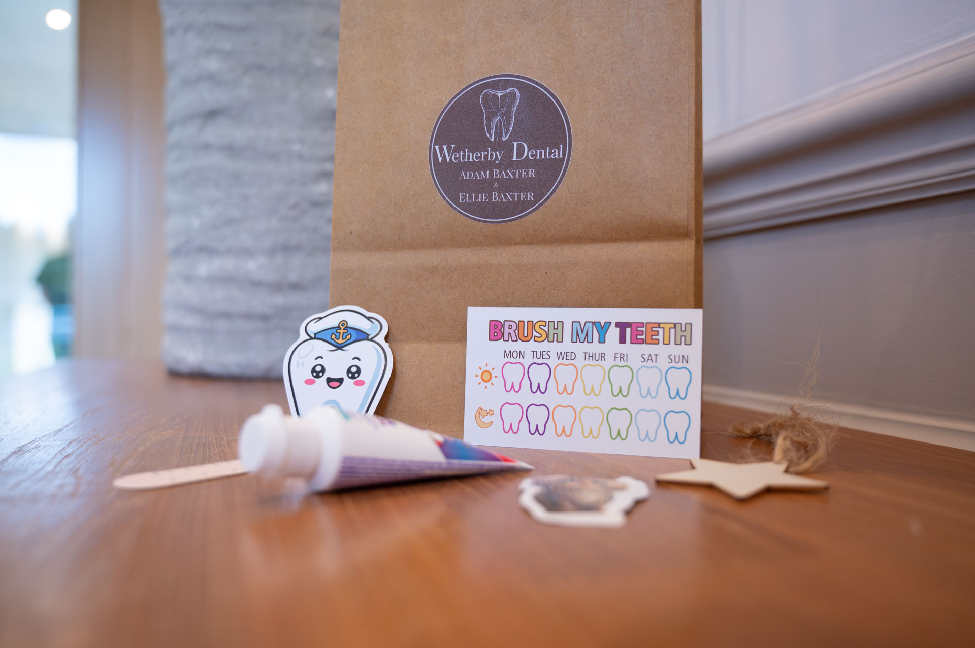 Children's goody bag with a toothbrush and a reward chart