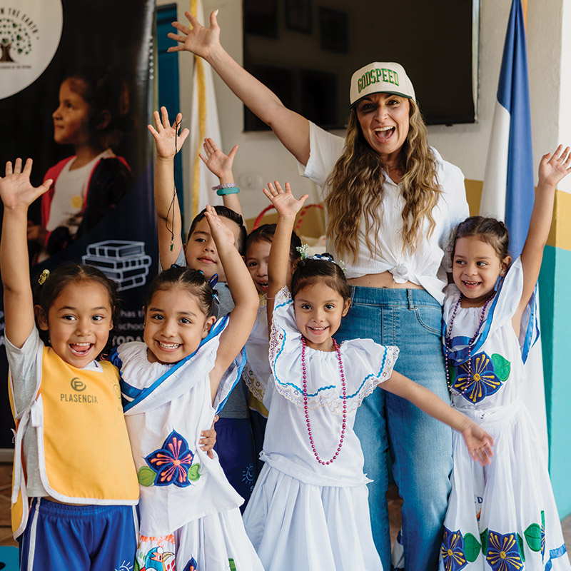CAT Collective founder Cat Gagliardo with children at a community event