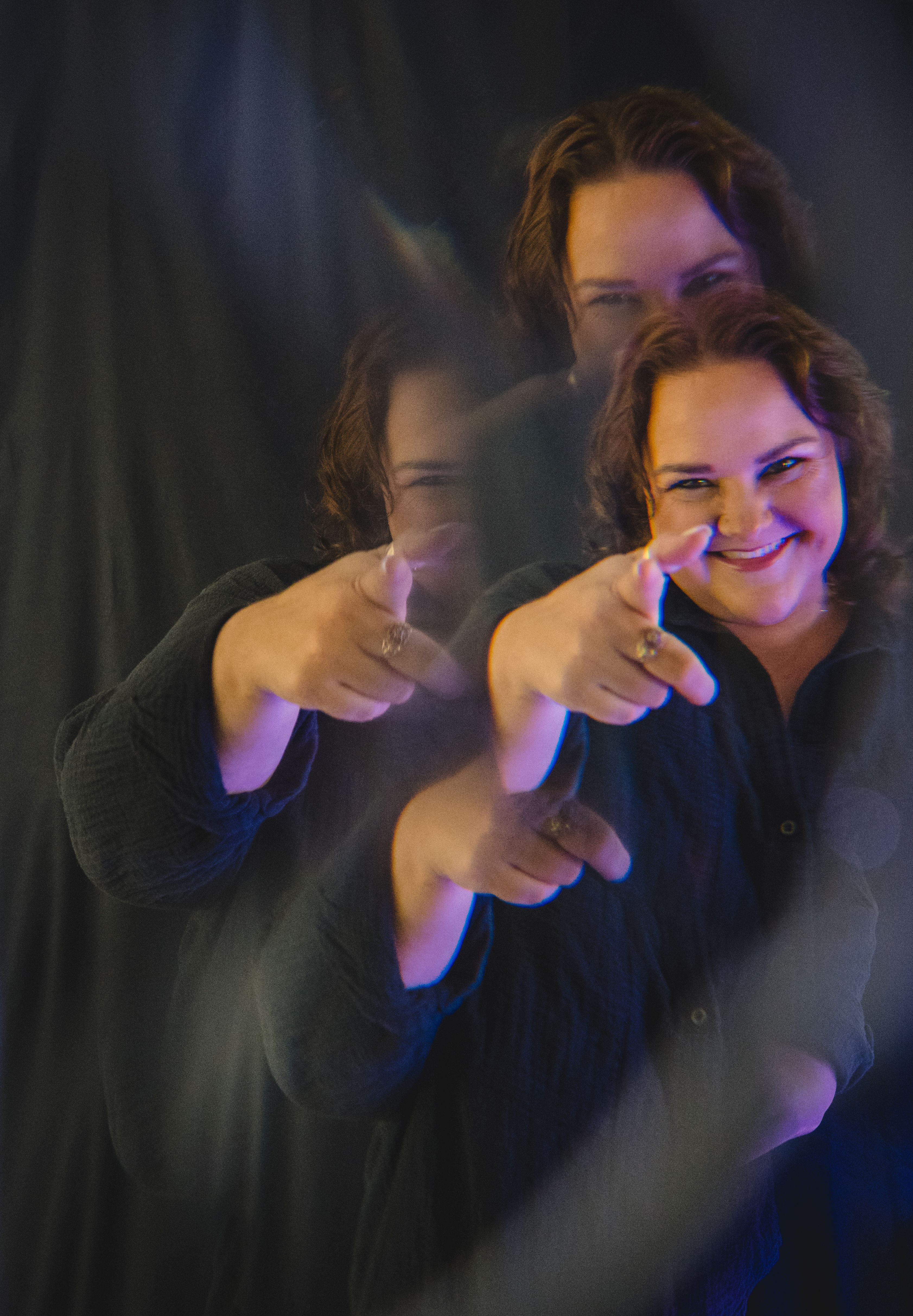Fragmented photo of Building My Daydream founder, Brandi Zapchenk pointing straight at the camera
