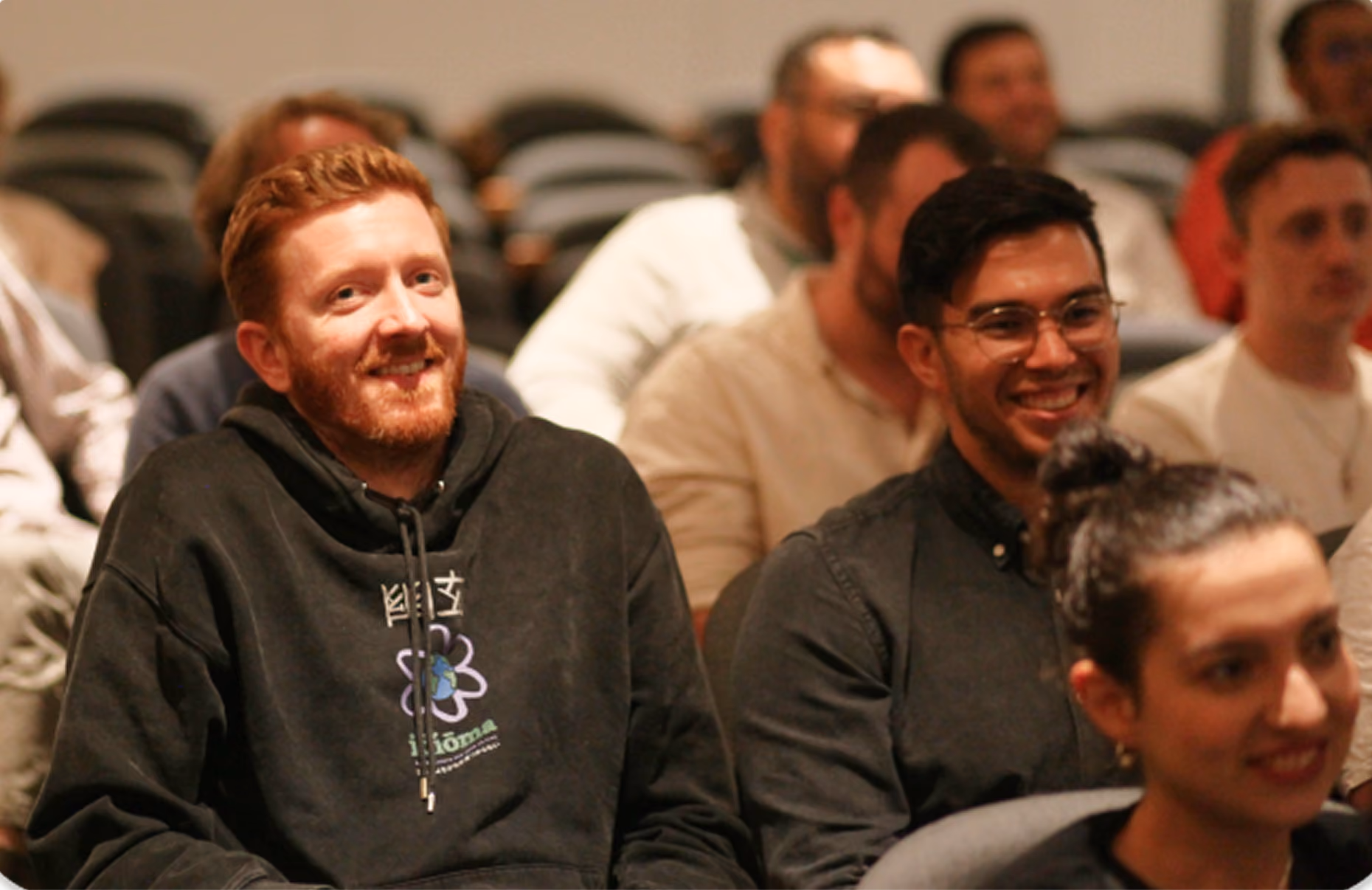Flixmedia colleagues seated at a company event