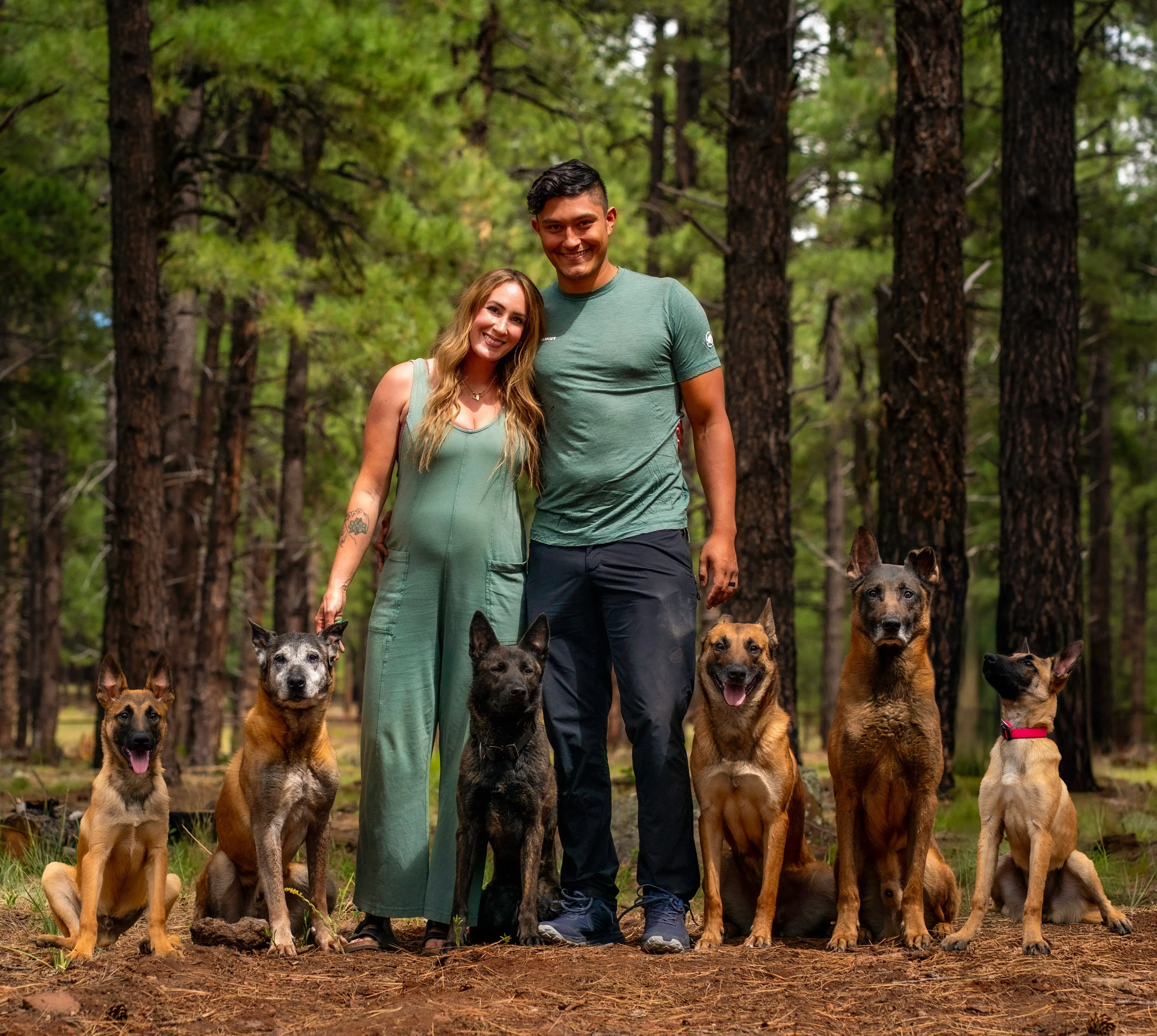 Family outdoors with their dogs after training