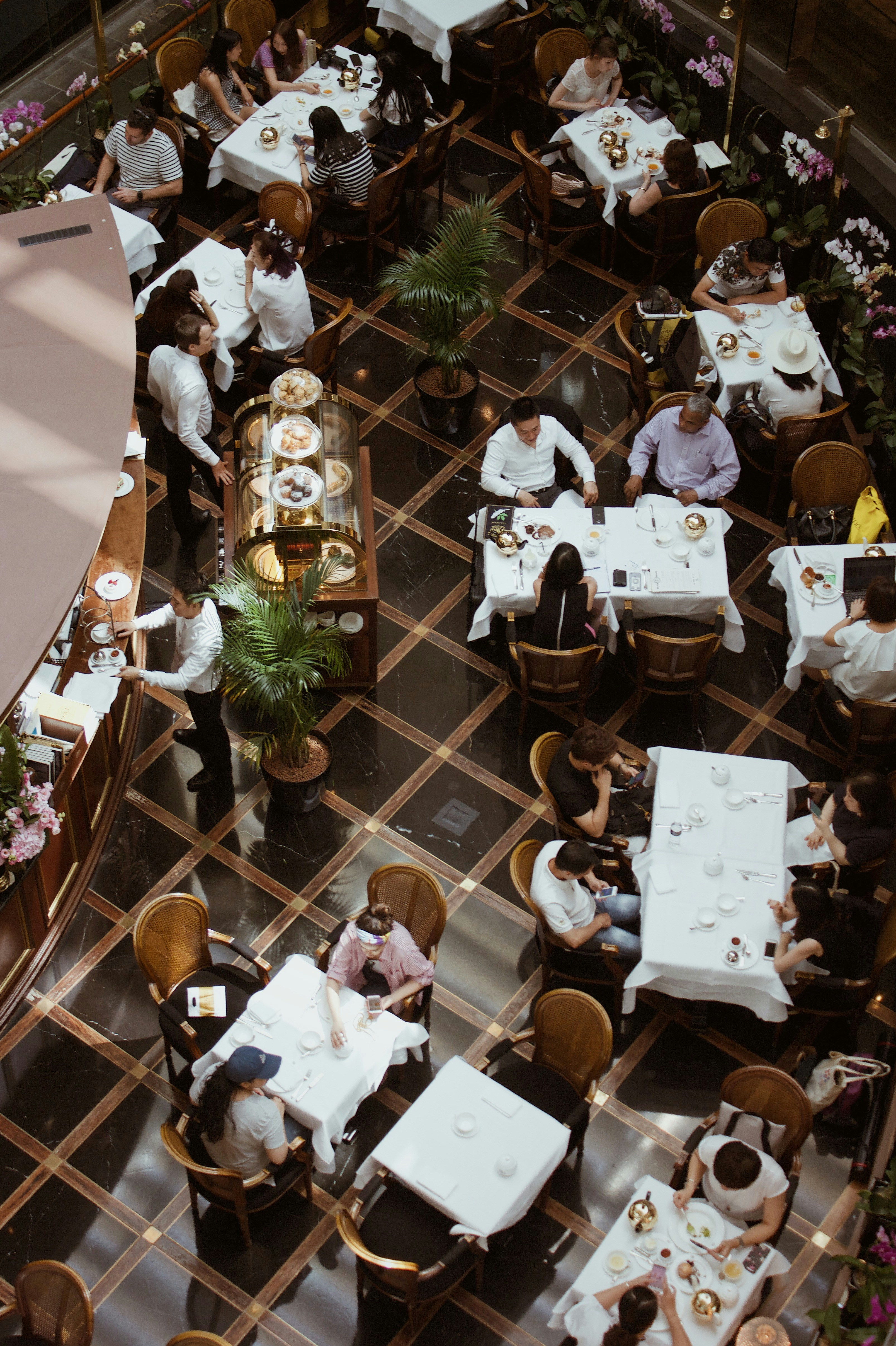 Operator reacting at a Toast POS terminal on a busy restaurant floor