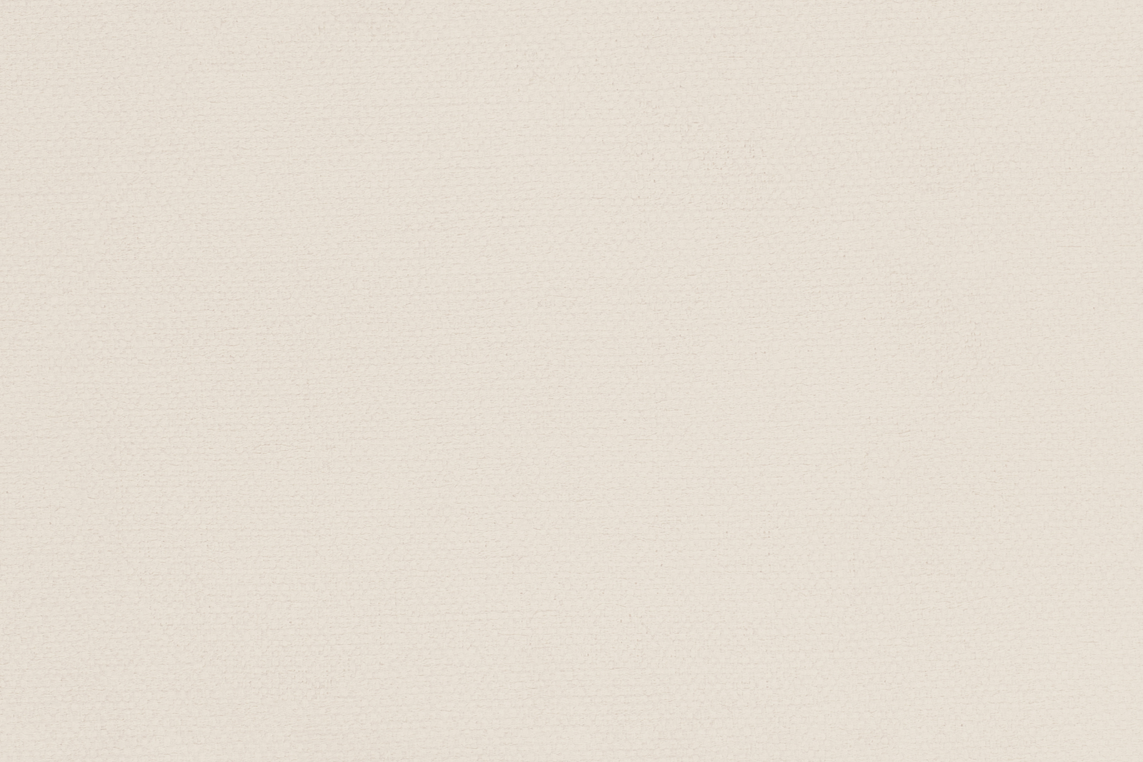 Close-up of light beige sand with rippled patterns formed by wind.