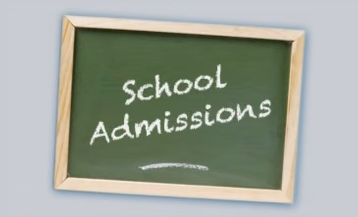 Chalkboard sign reading School Admissions