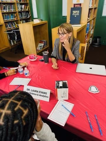 Dr Laura Evans speaks with students at a library career panel