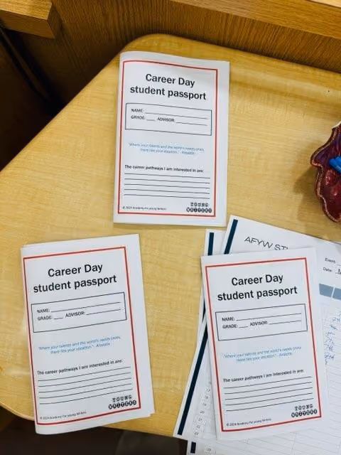 Career Day student passport booklets on a desk