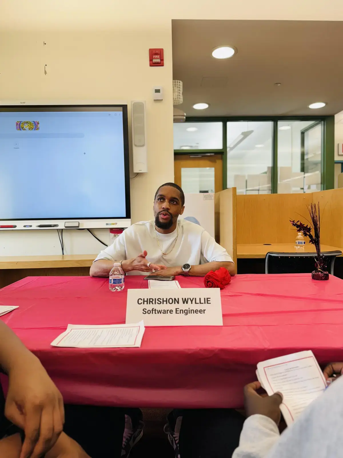 Software engineer Chrishon Wyllie speaks to students at career panel