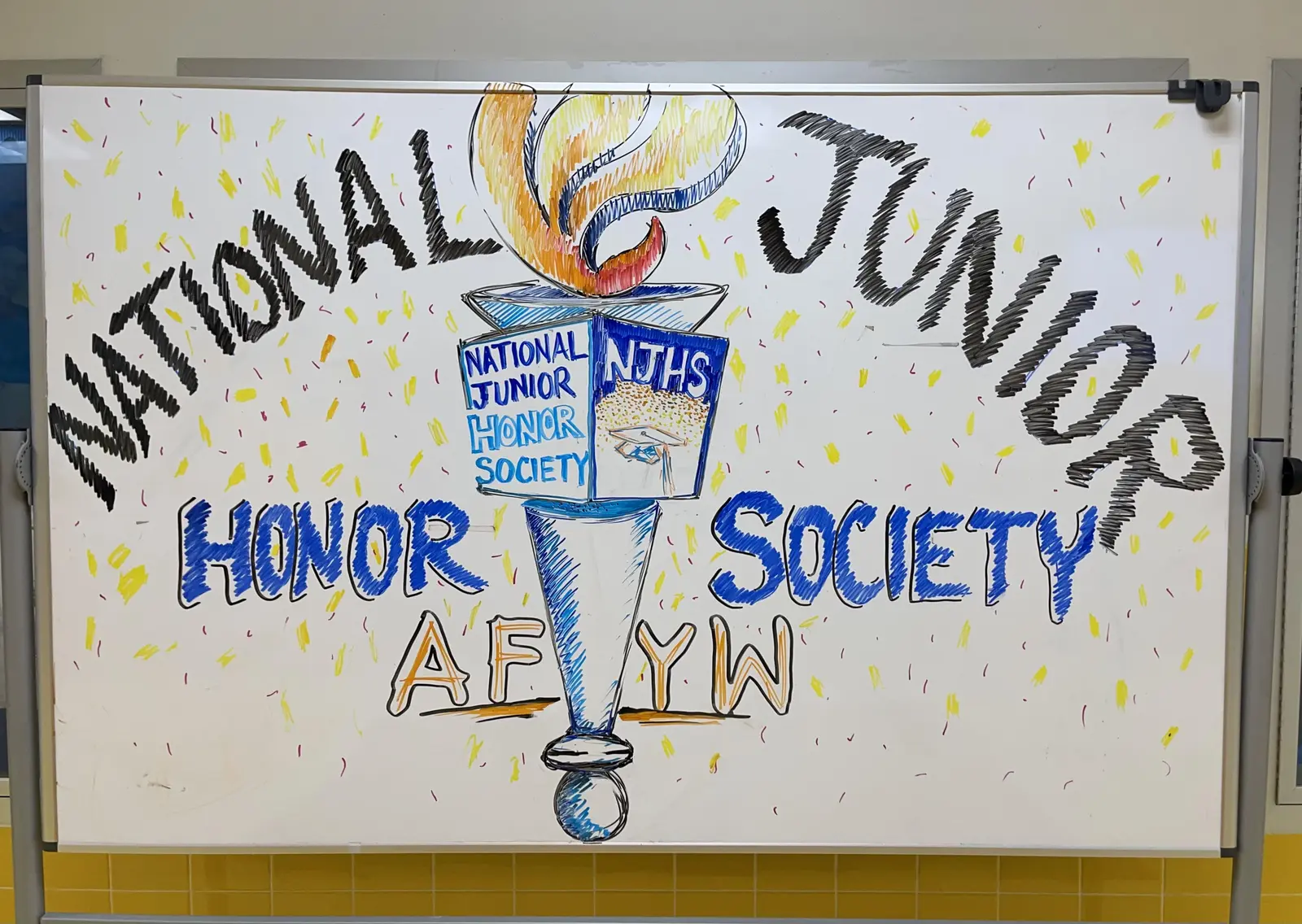 Hand-drawn whiteboard sign for National Junior Honor Society NJHS