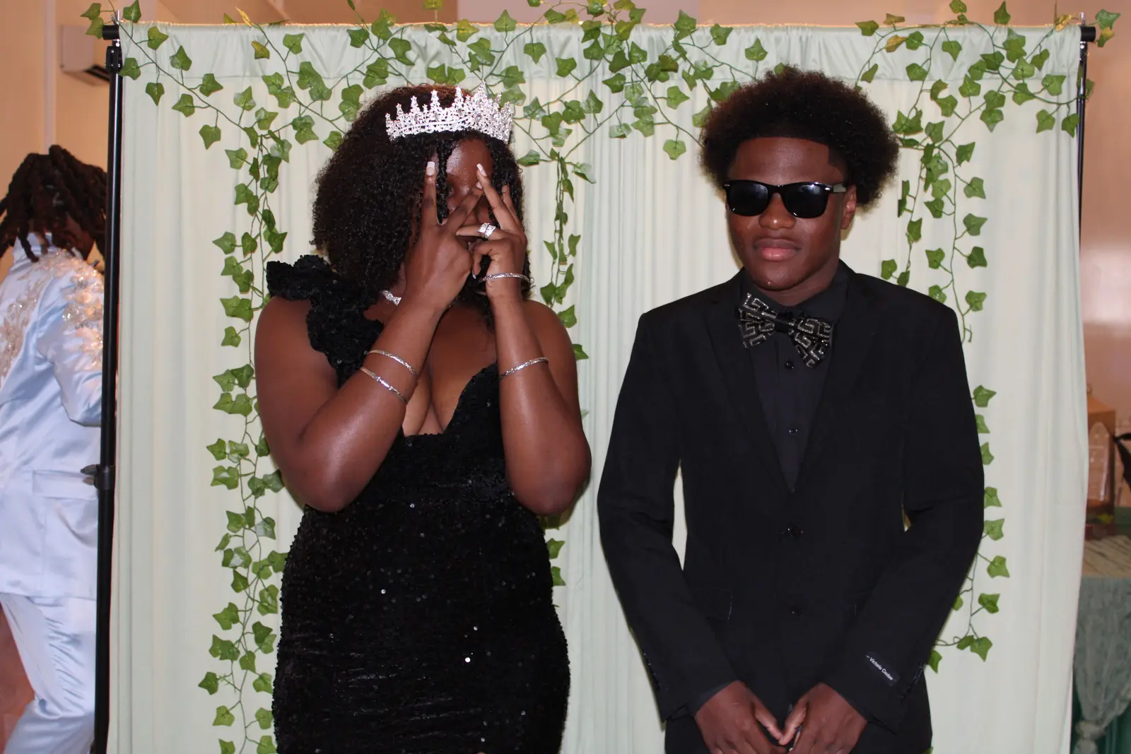 Two students dressed formally at a school prom event