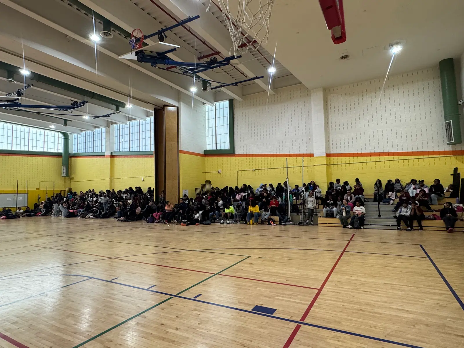 Students gathered in school gymnasium for a large assembly event