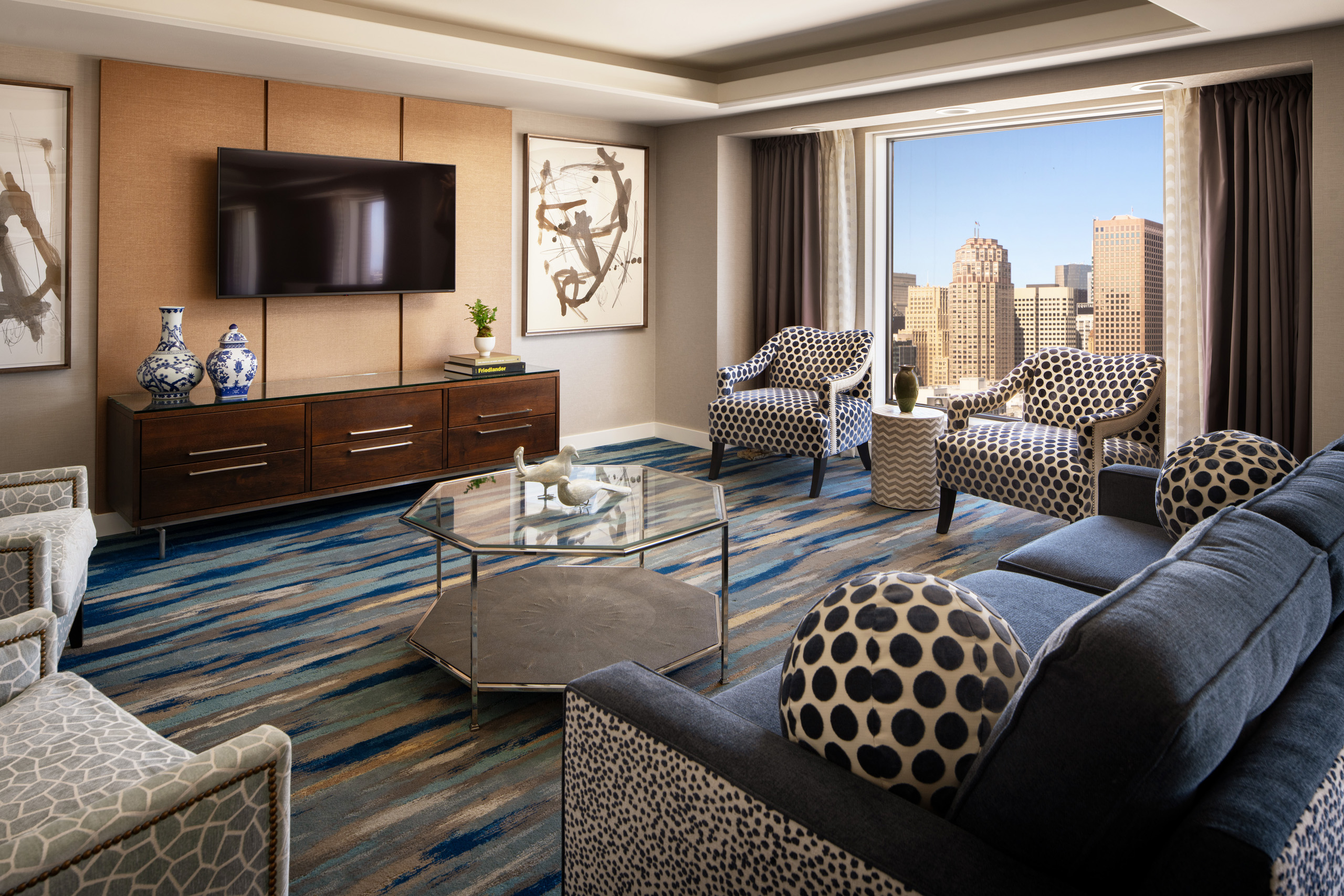 Imperial suite living room with city-view seating area.