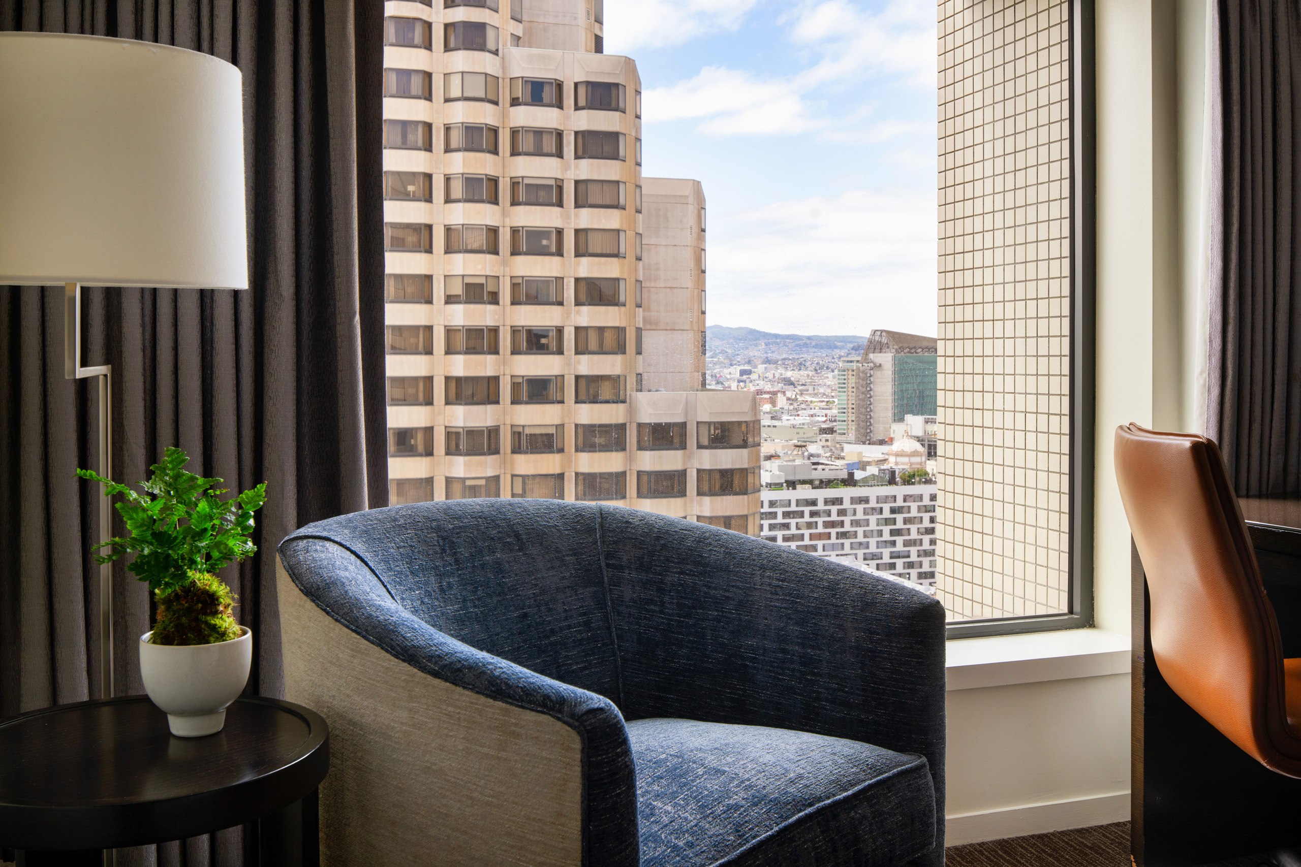 detail image of a stately modern chair next to a workspace