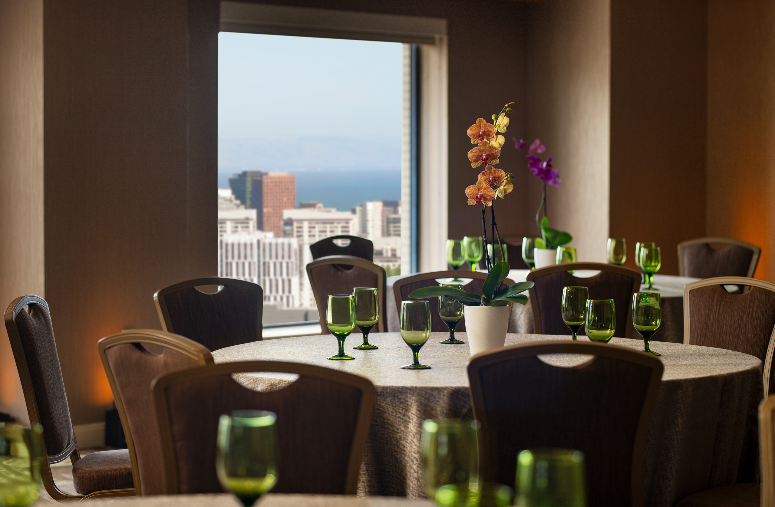 Conference room with round tables and presentation screens