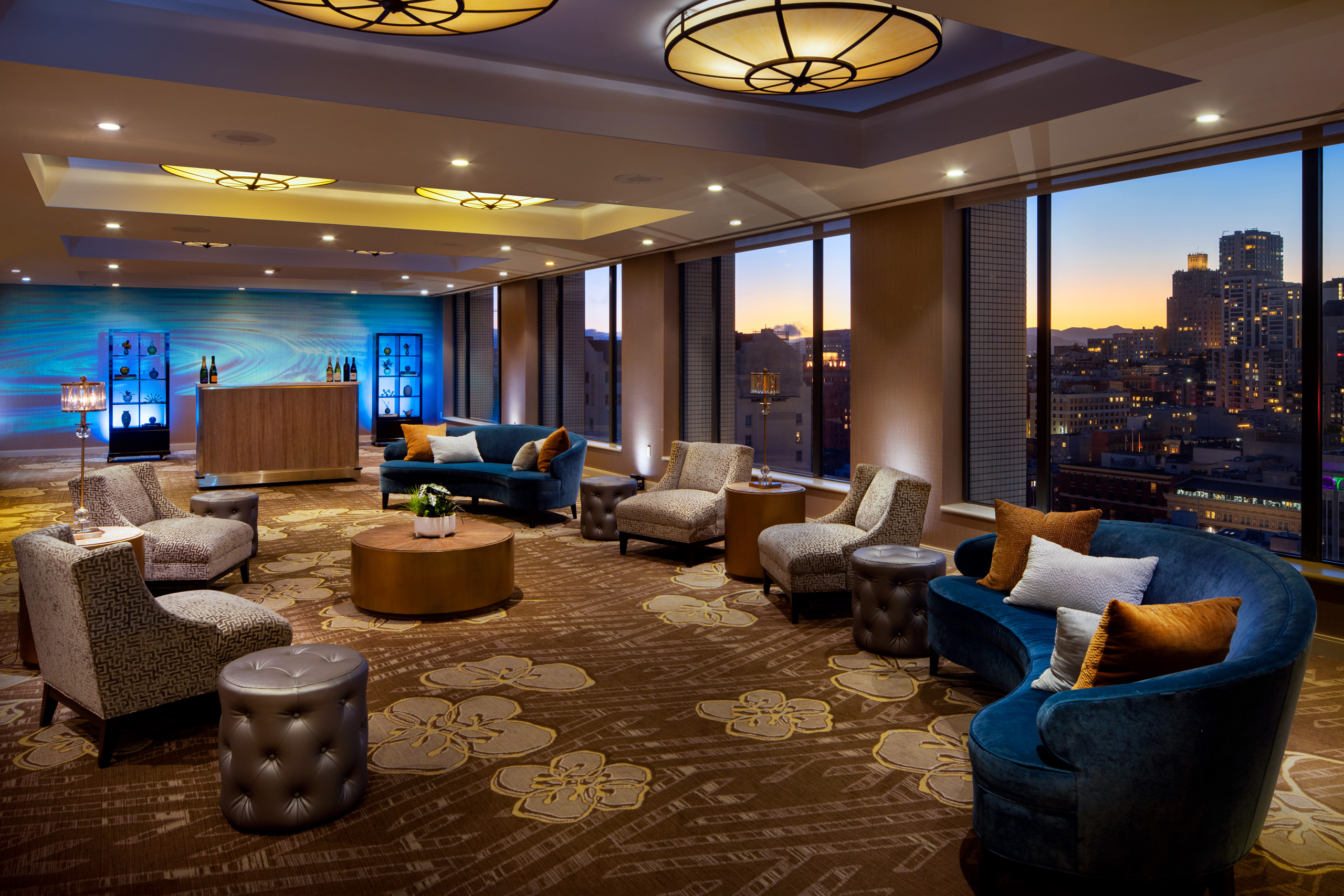 Elegant event lounge with city views and contemporary seating.