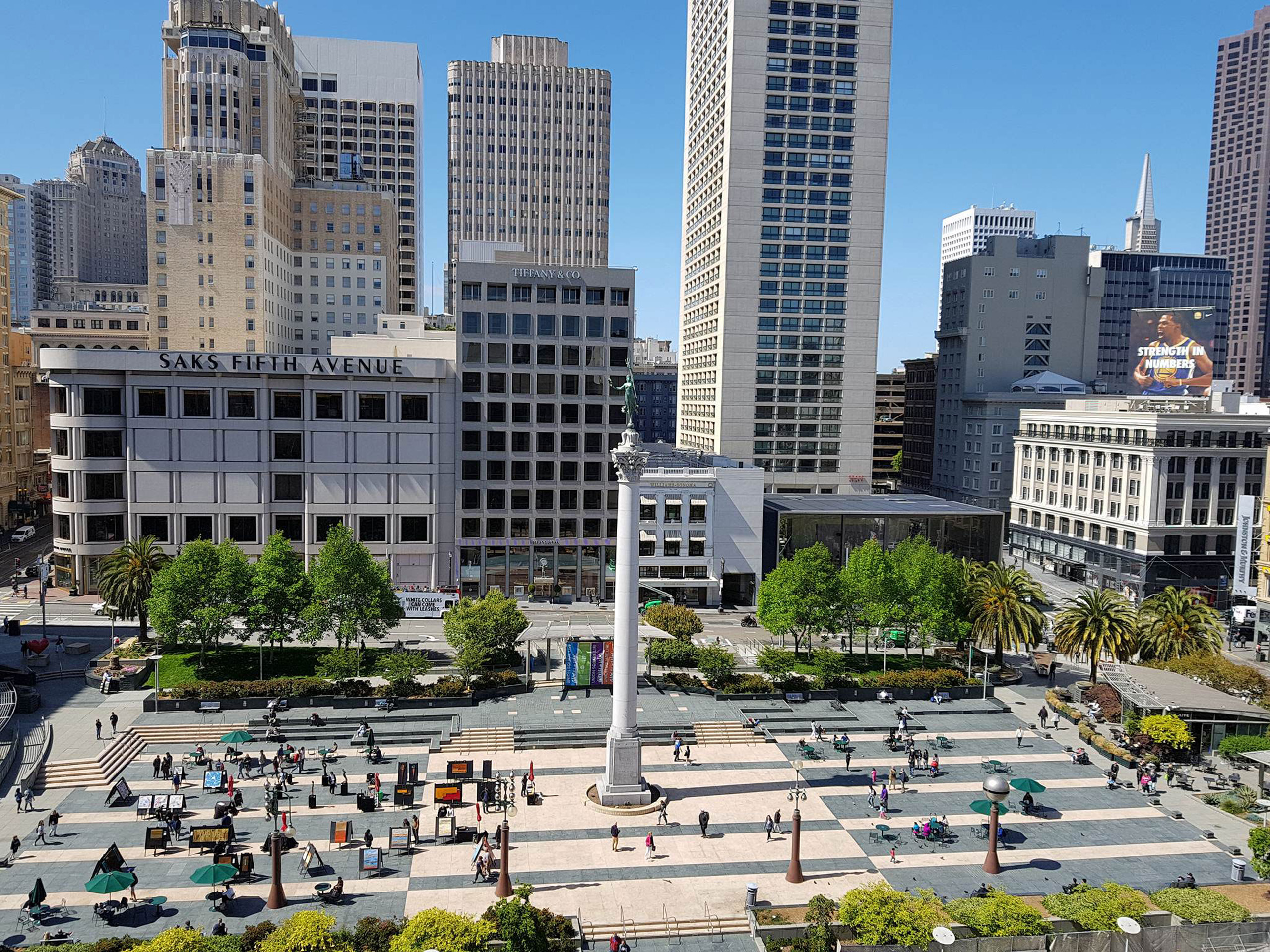 Union Square plaza and monument surrounded by downtown buildings.