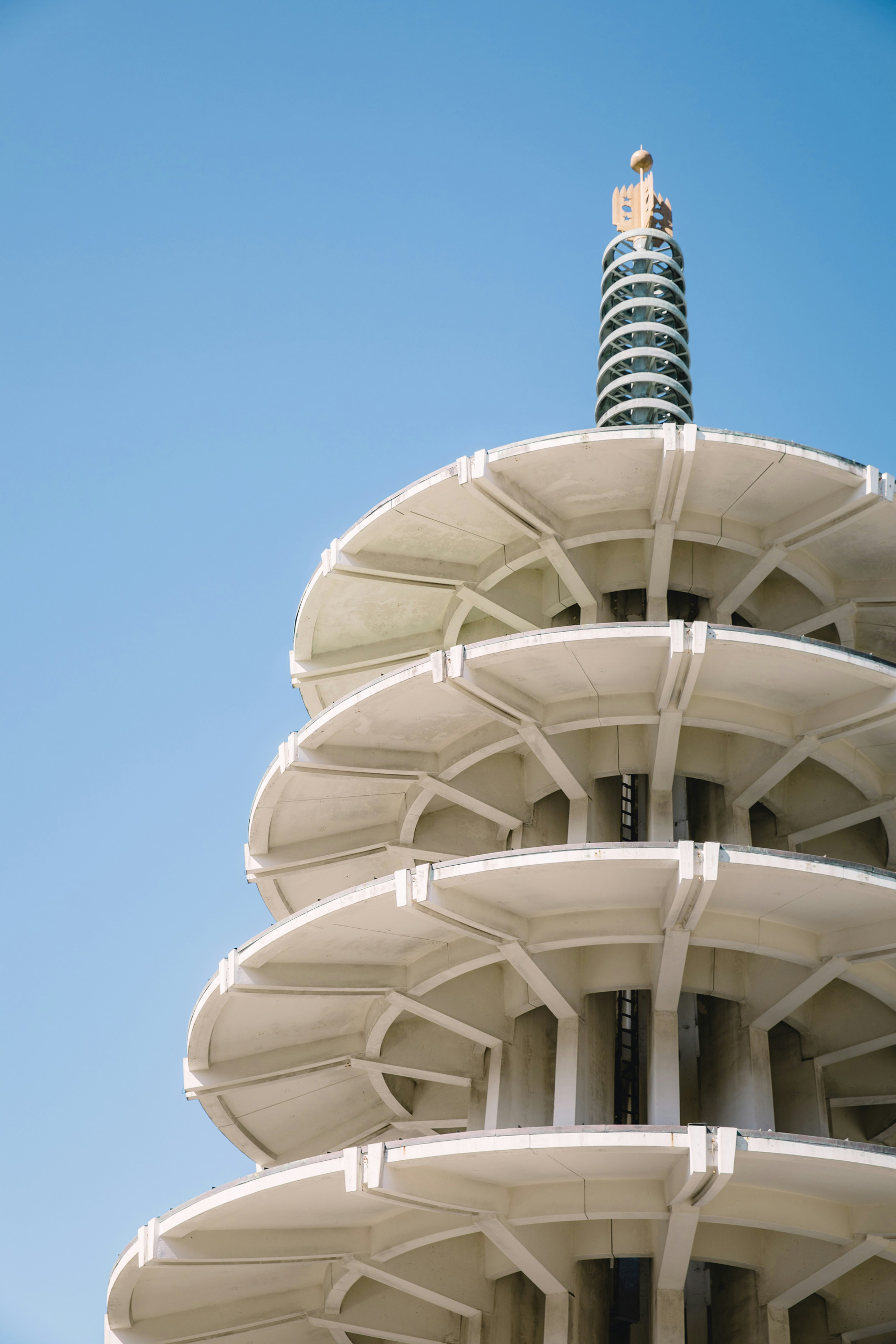 Peace Pagoda tower against a clear blue sky.