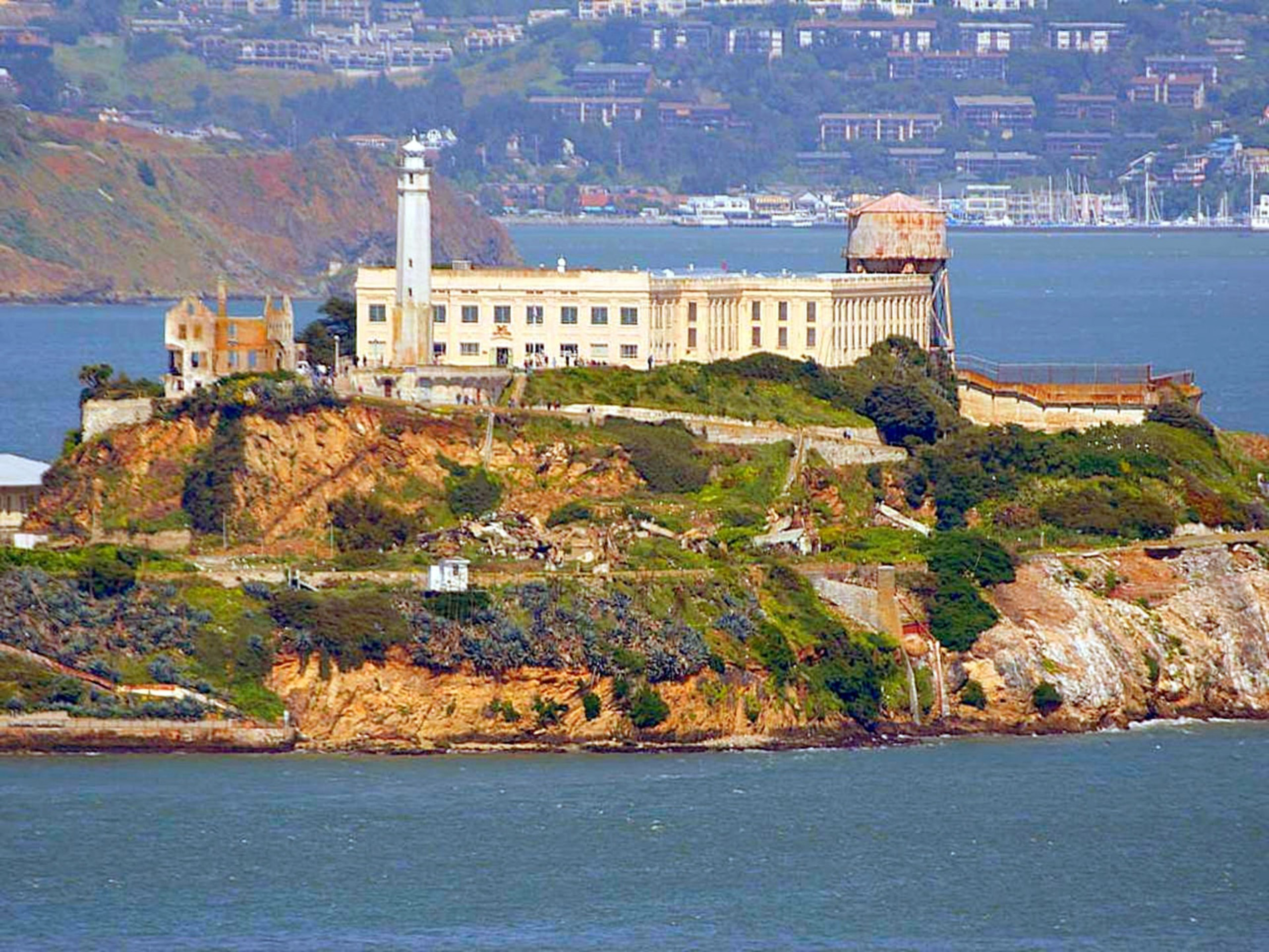Alcatraz Island with prison buildings and lighthouse.