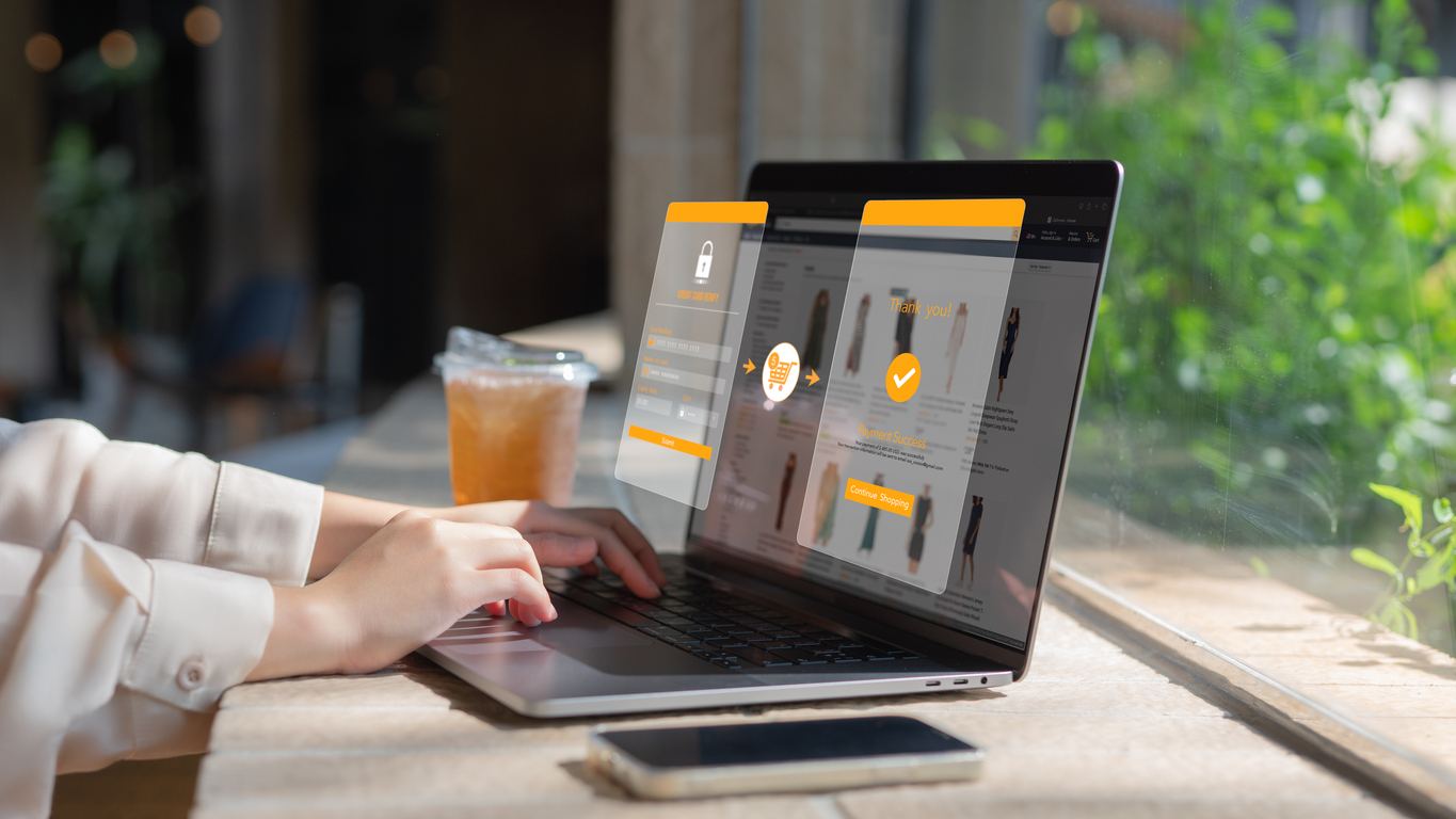 A customer completes personal purchases online using a virtual credit card and her laptop.