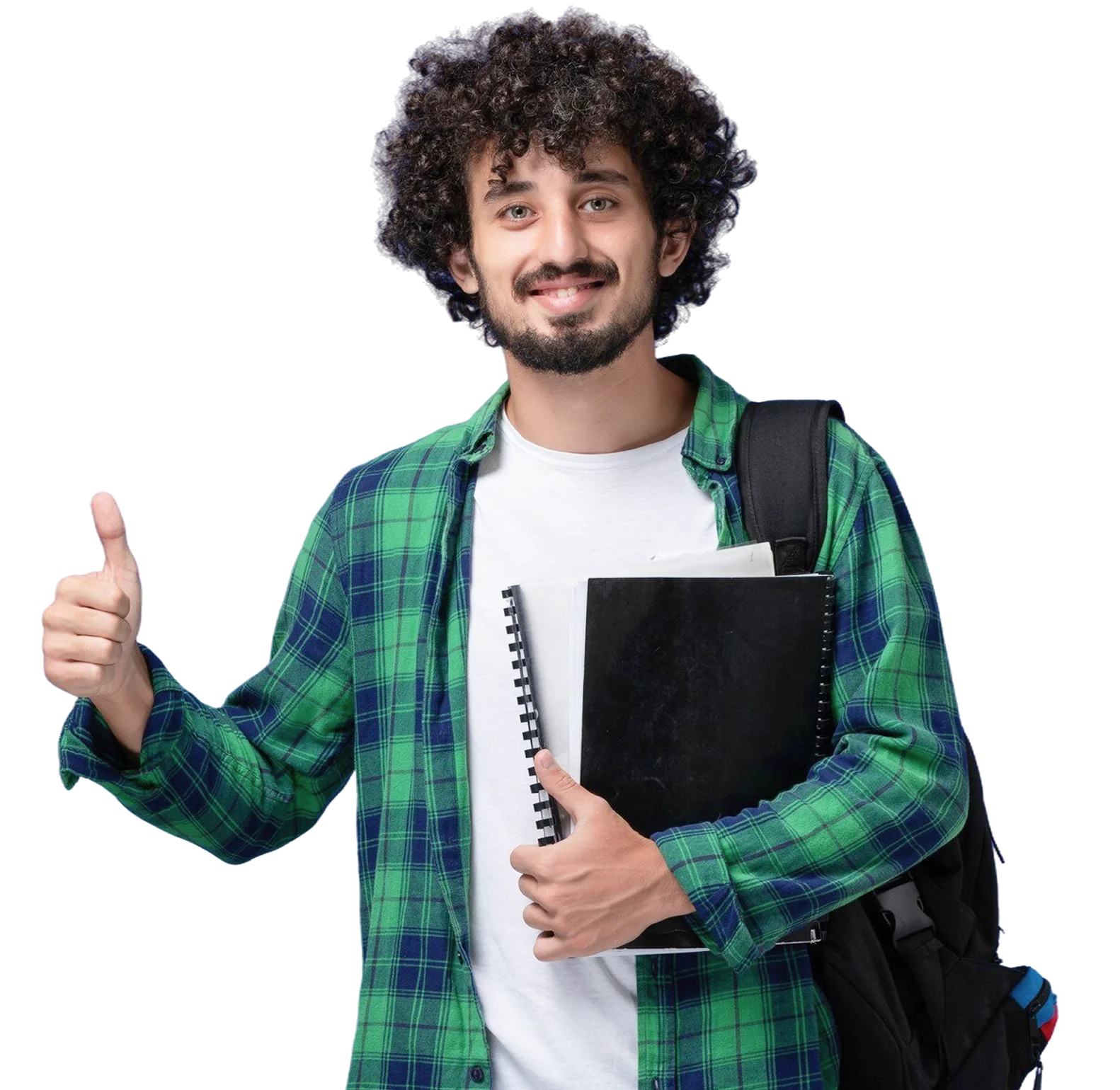 Smiling young man with curly hair in green plaid shirt shows thumbs up while holding notebooks.