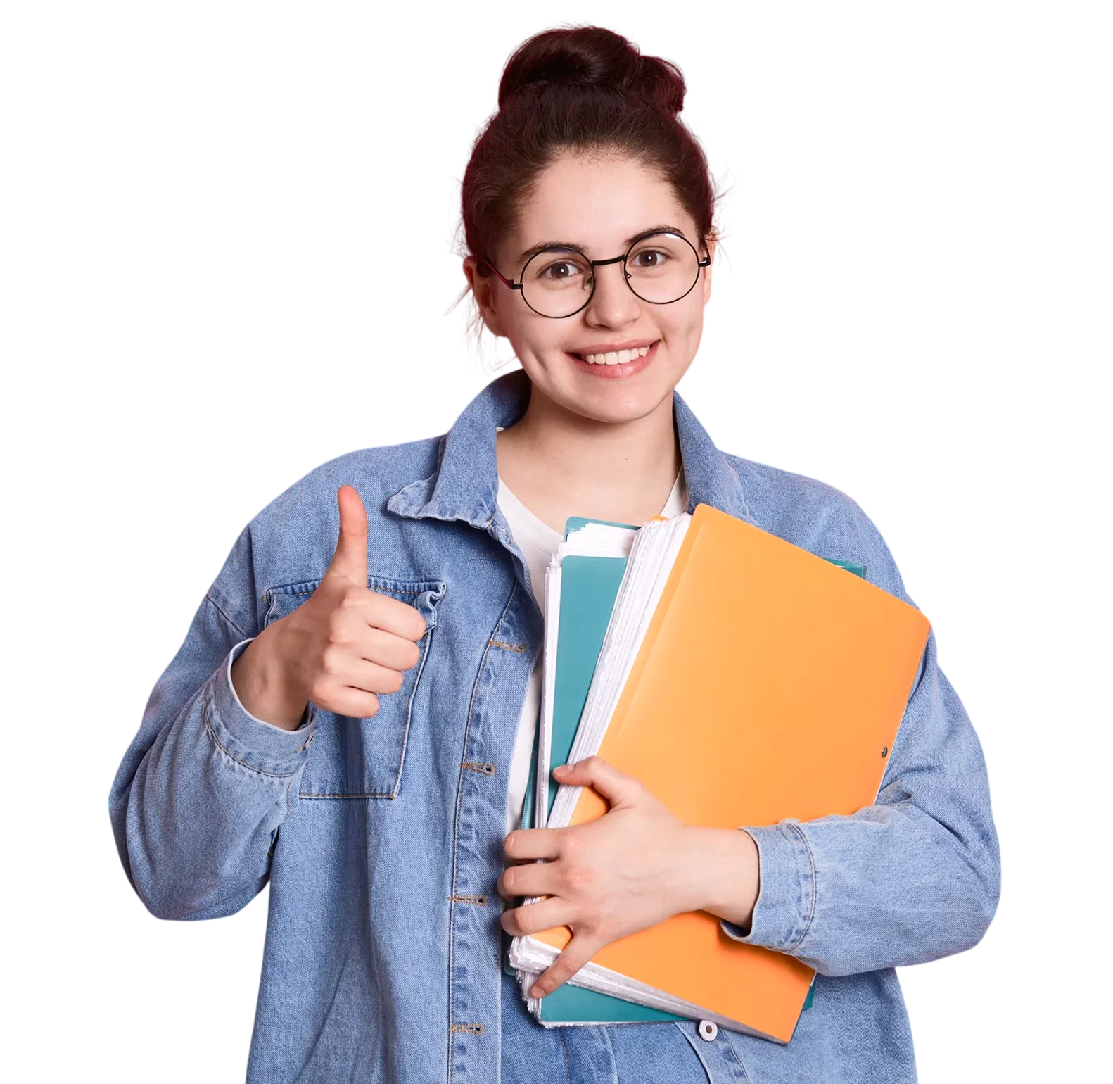 Smiling young woman with glasses and hair in a bun wearing a denim jacket, holding notebooks and folders, showing thumbs up.