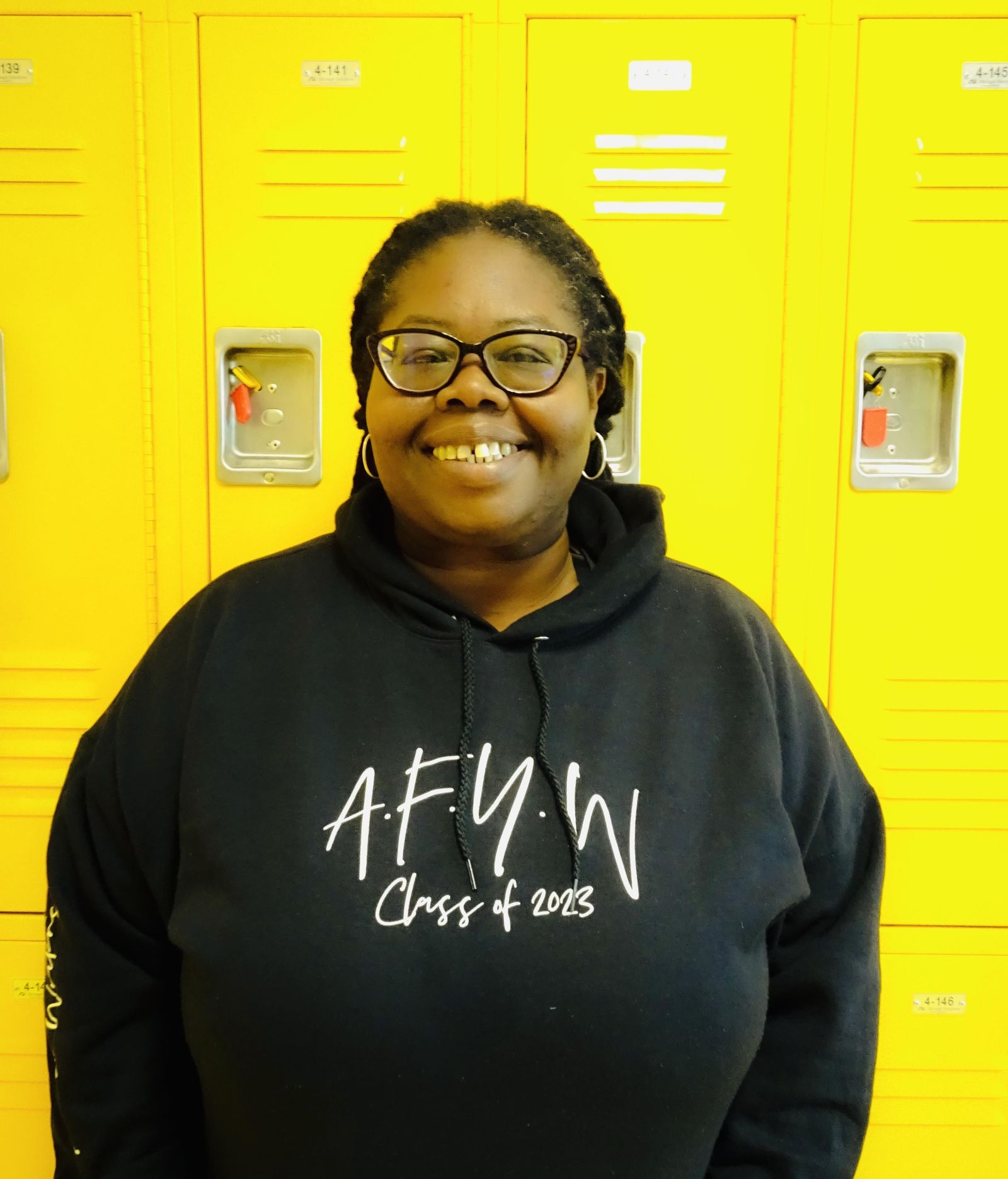 Latoya Lorde wearing AFYW Class of 2023 hoodie by lockers