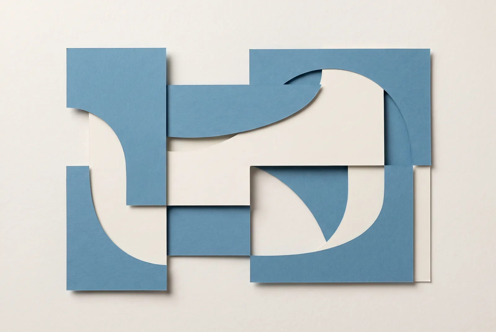 A cut paper collage of blue and cream rectangles and curves arranged on a pale ground, New Beach journal