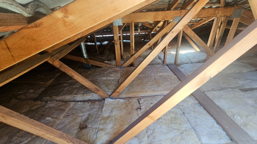 R5 Bradford Gold ceiling insulation batts laid between timber joists in a roof space