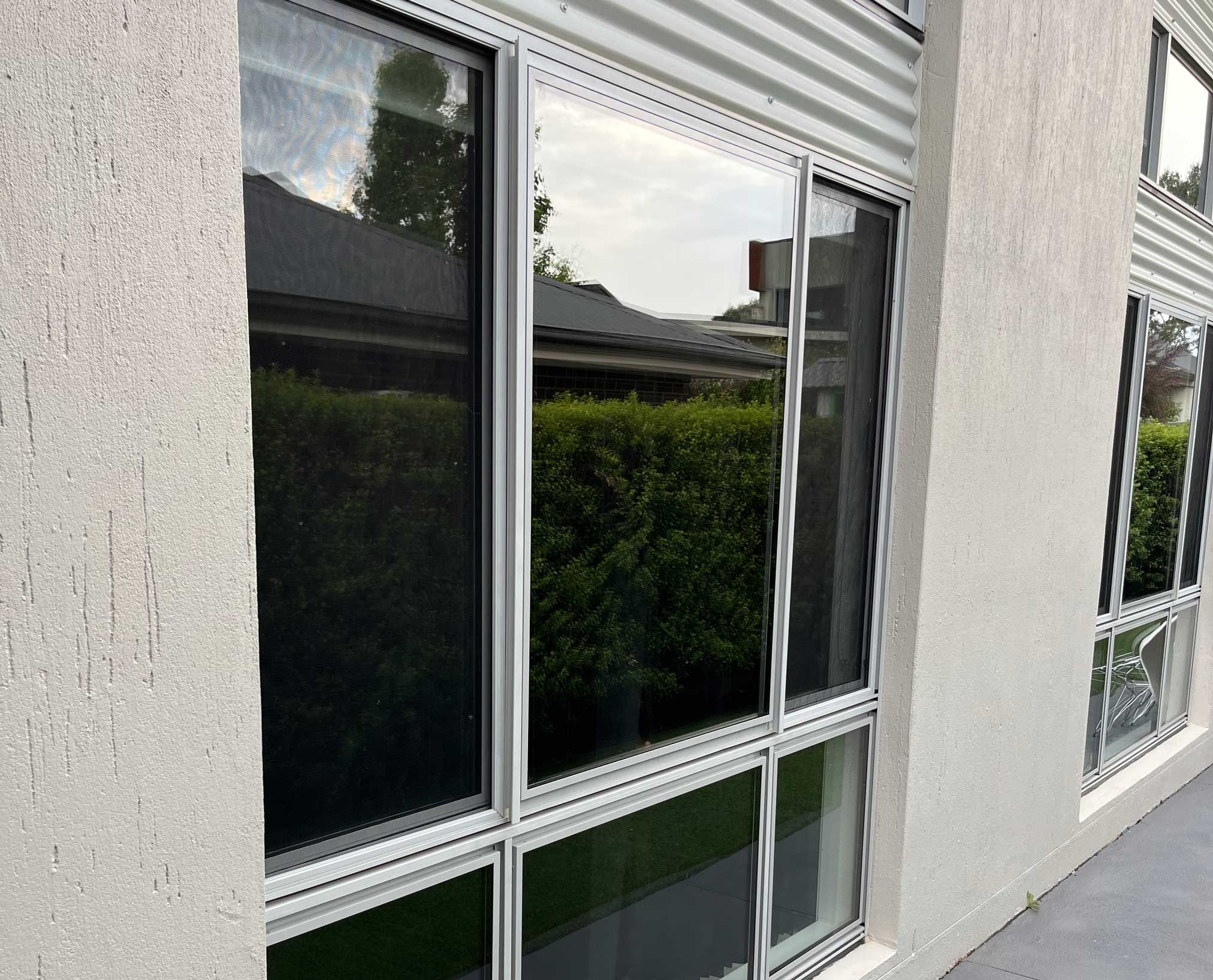 Retrofitted double glazing in existing aluminium window frames, seen from the garden