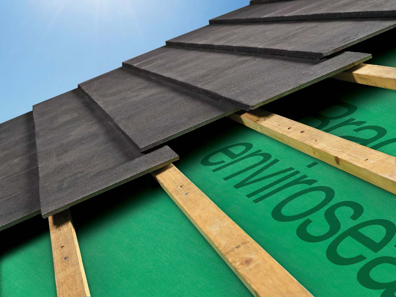 Green Enviroseal roof sarking laid over roof battens beneath dark roof tiles