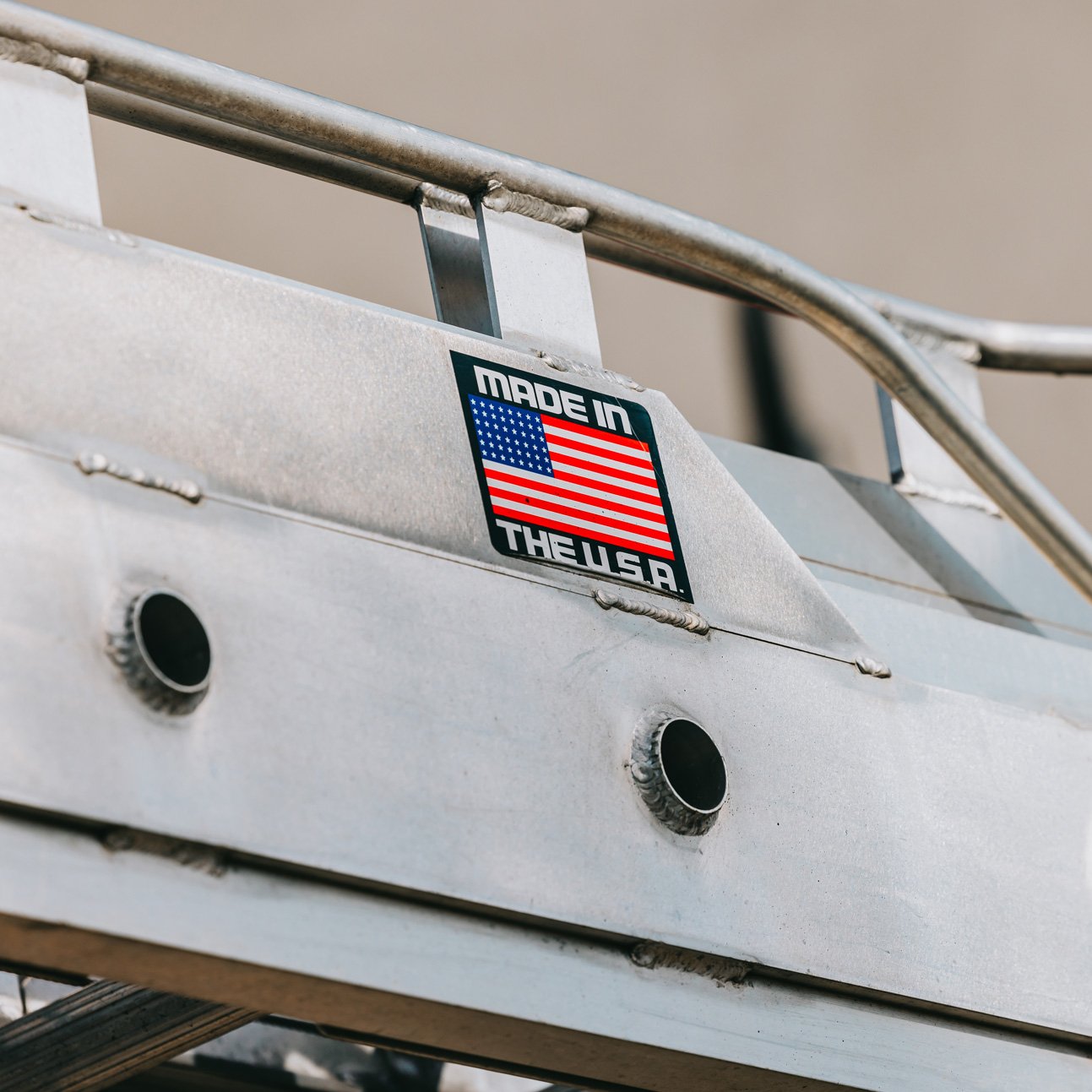 Side view of the Rick Signs Van Ladder bucket truck with American flag decal — Chicago sign repair fleet