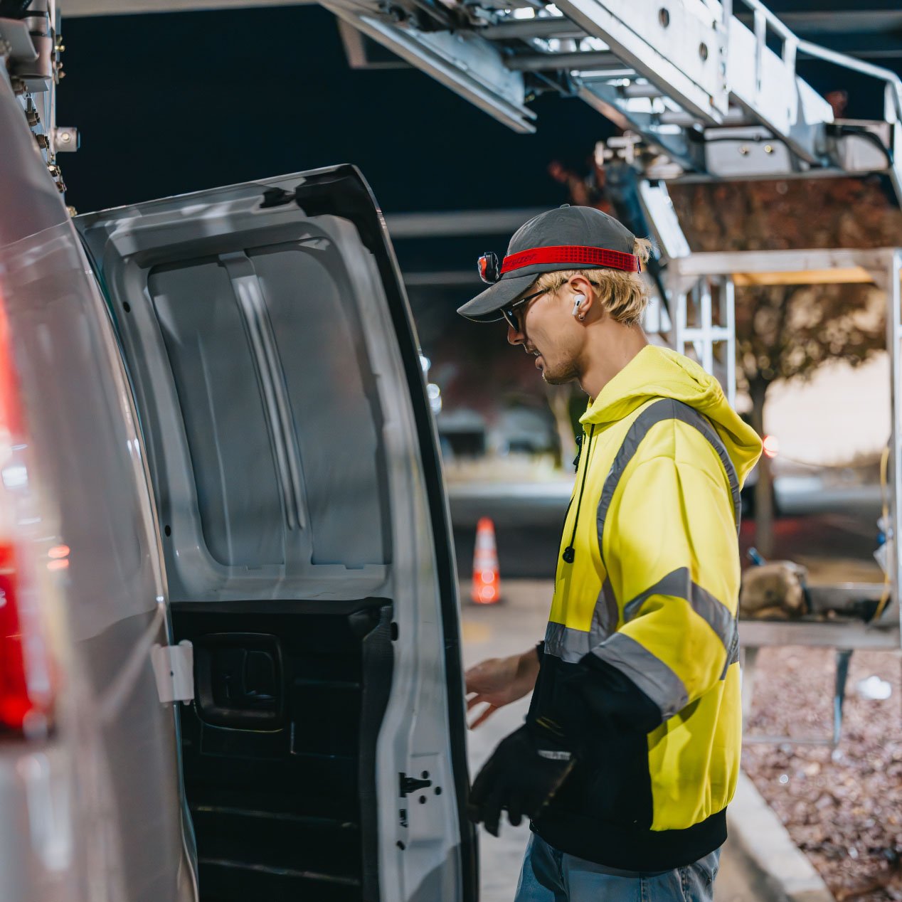 Tymothy Mough next to the Rick Signs service van with equipment for a Chicago sign repair job